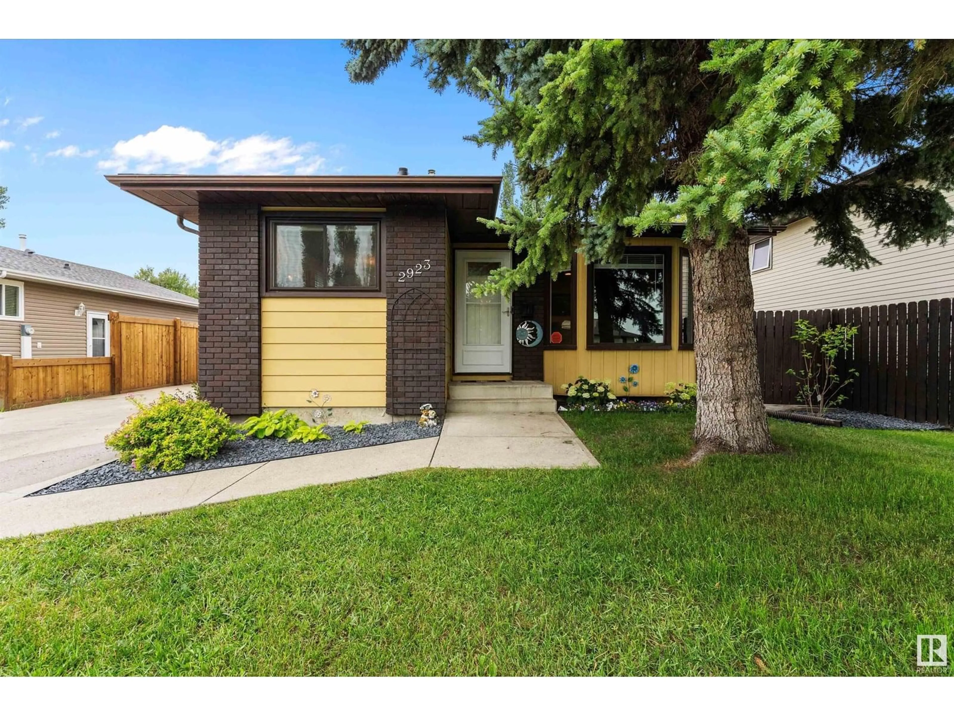 Home with vinyl exterior material, street for 2923 149 AV, Edmonton Alberta T5Y2C5
