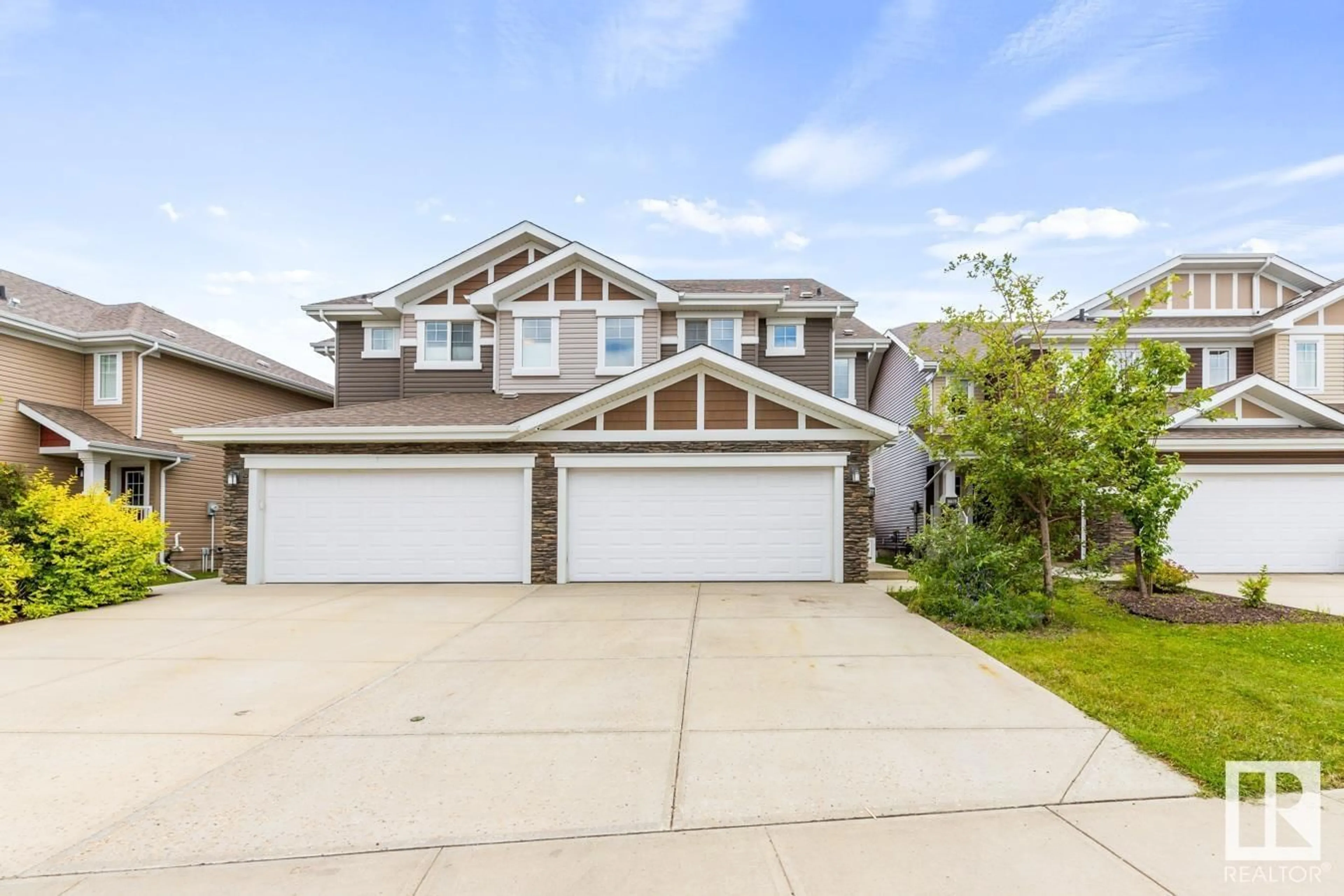 Home with vinyl exterior material, street for 16617 14 AV SW, Edmonton Alberta T6W3C3