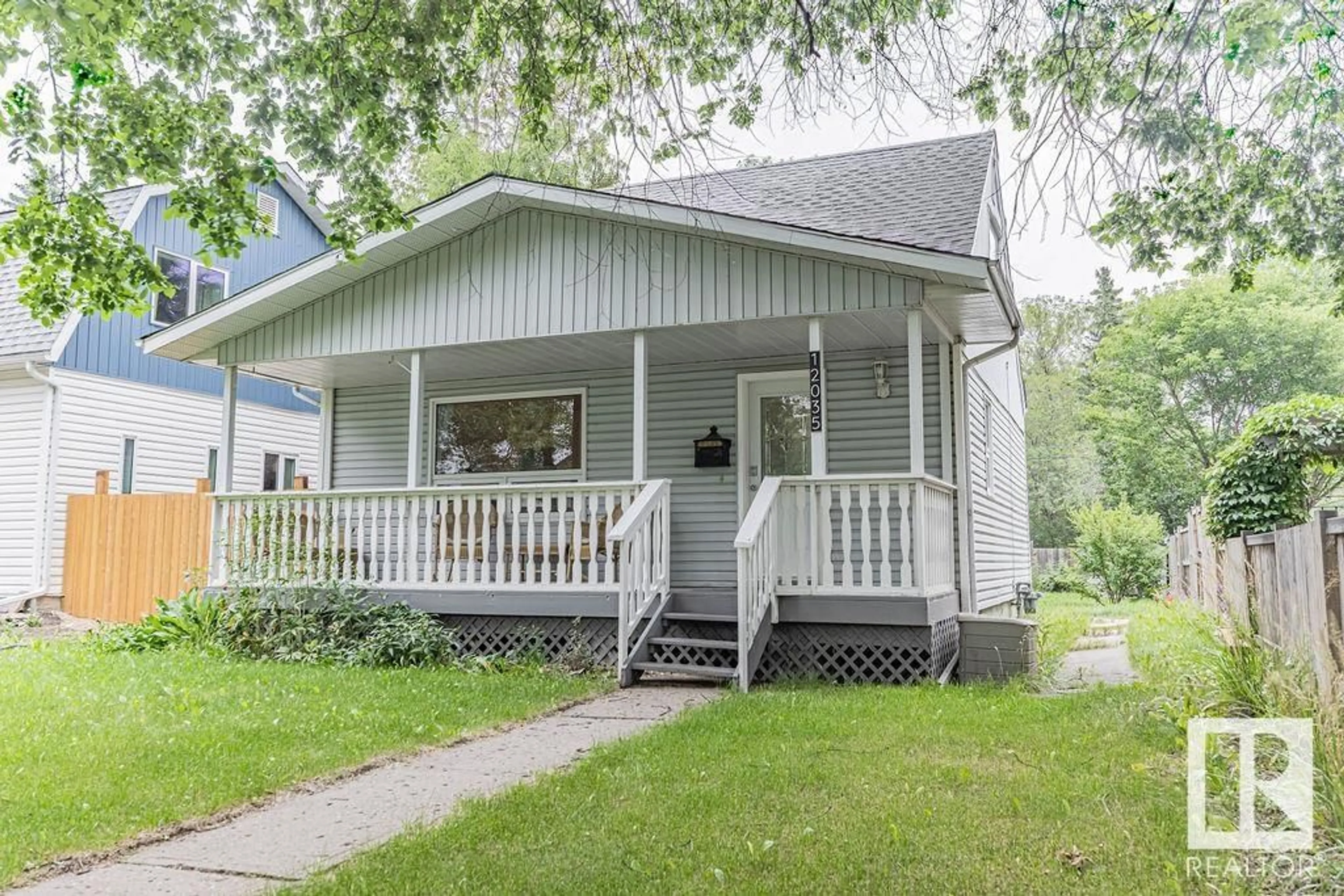 Home with vinyl exterior material, street for 12035 126 ST NW, Edmonton Alberta T5L0W4