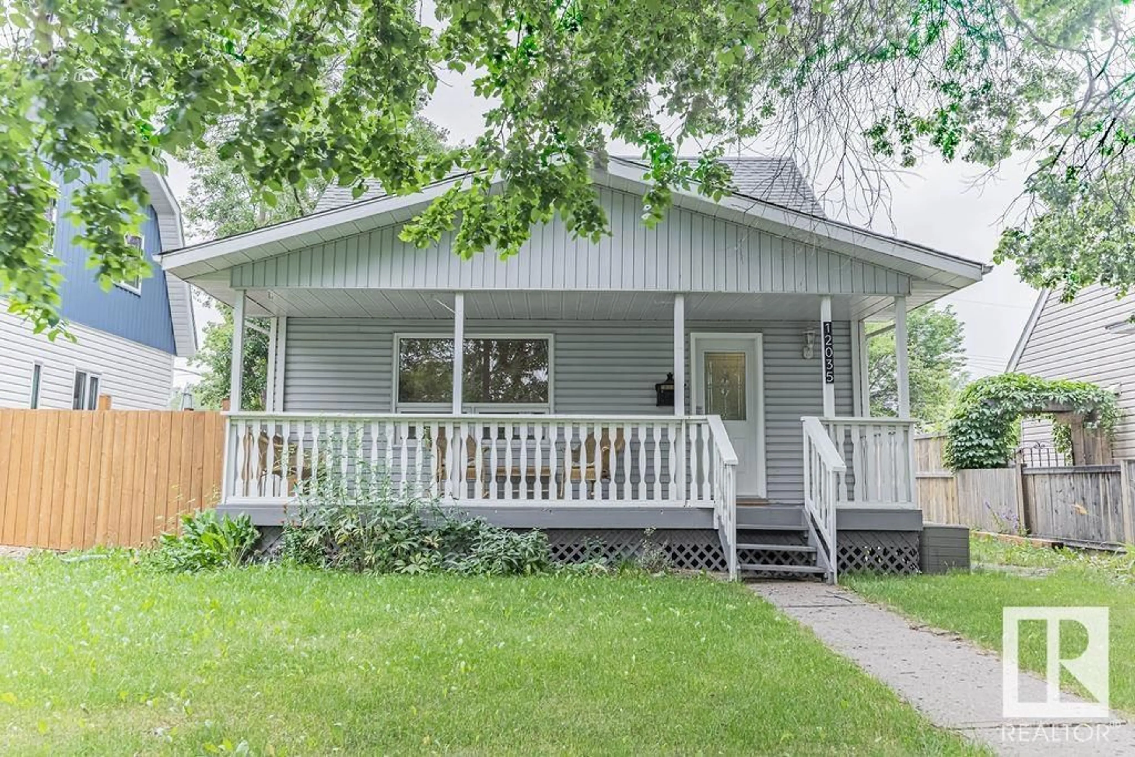 Home with vinyl exterior material, street for 12035 126 ST NW, Edmonton Alberta T5L0W4