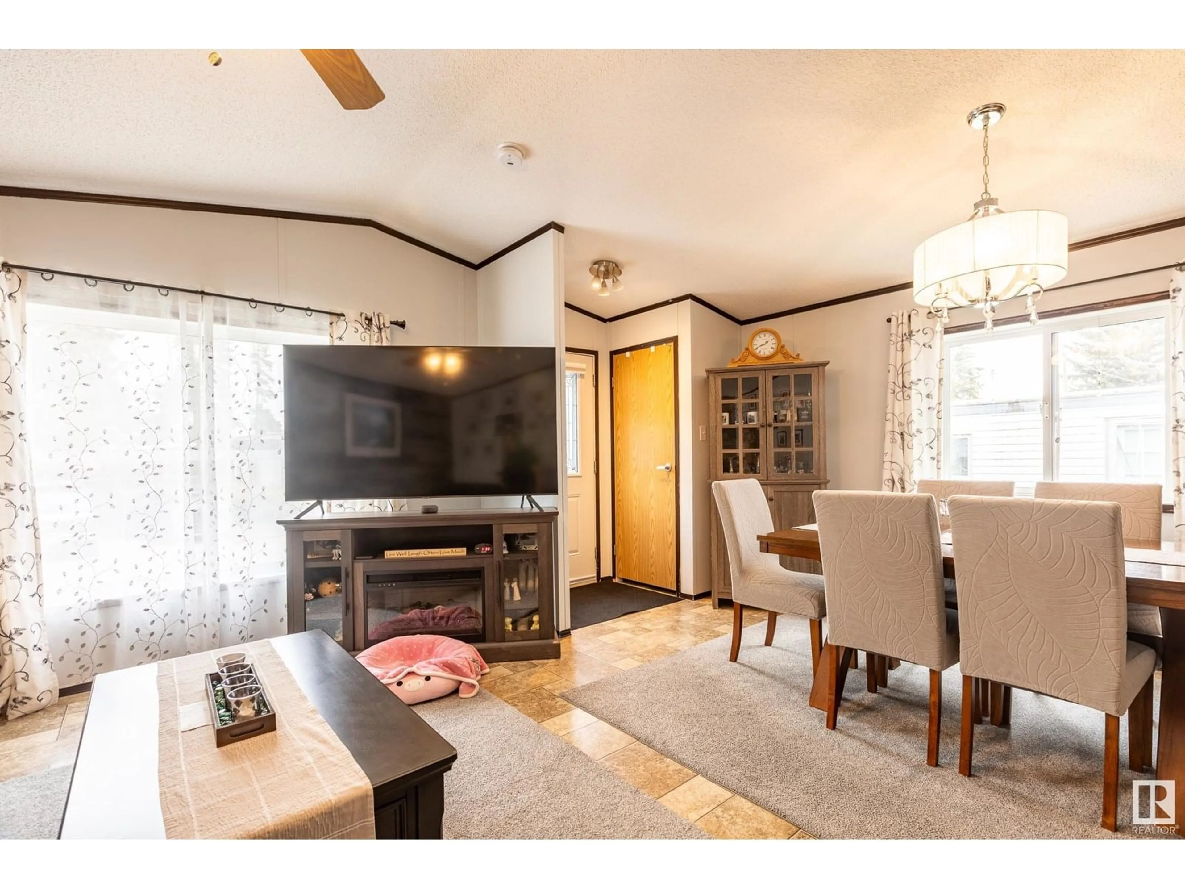 Living room with furniture, wood/laminate floor for 61 - 10410 101A ST, Morinville Alberta T8R1B2
