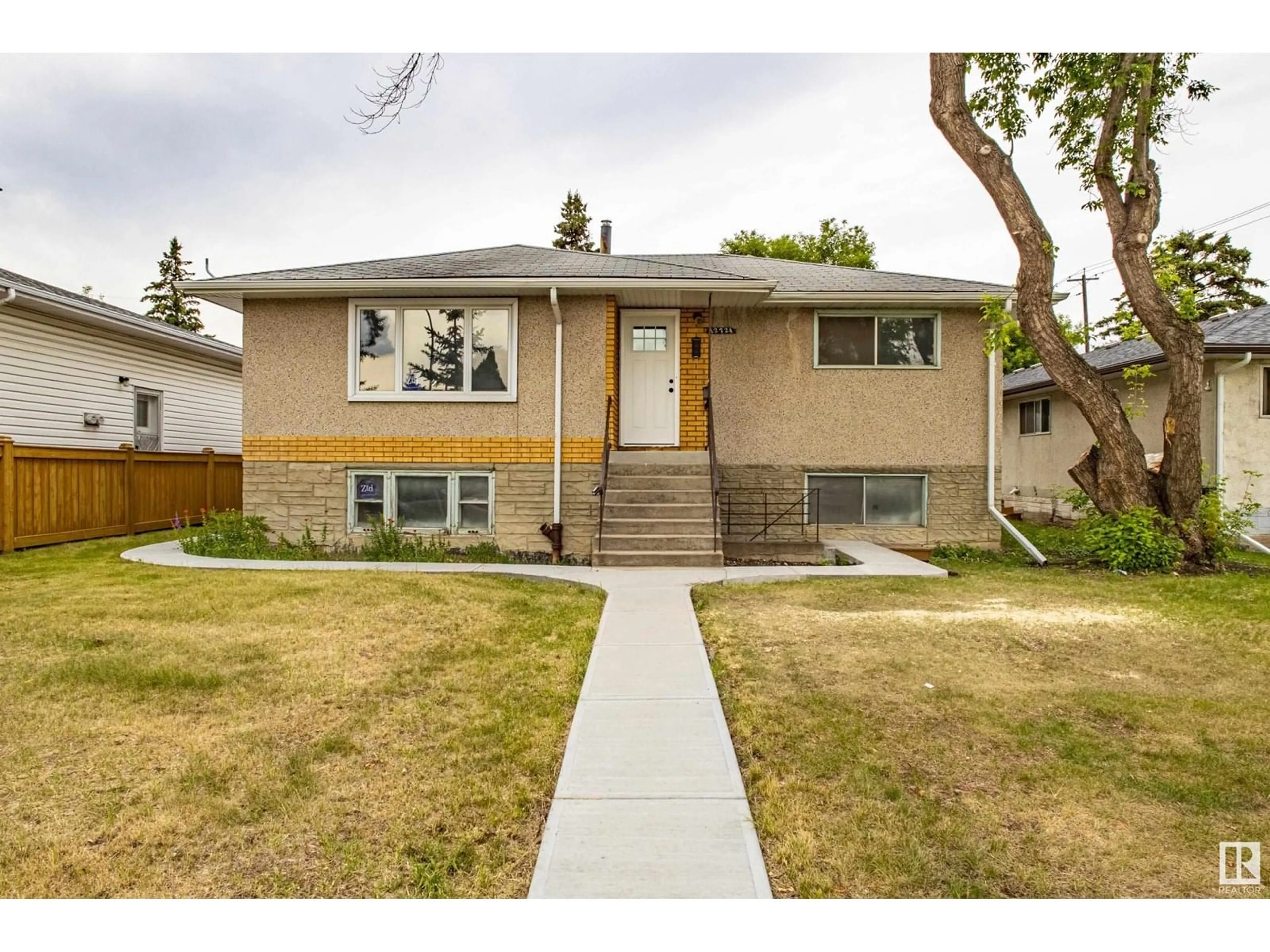 Home with vinyl exterior material, street for NW - 12724 92 ST, Edmonton Alberta T5E3R2