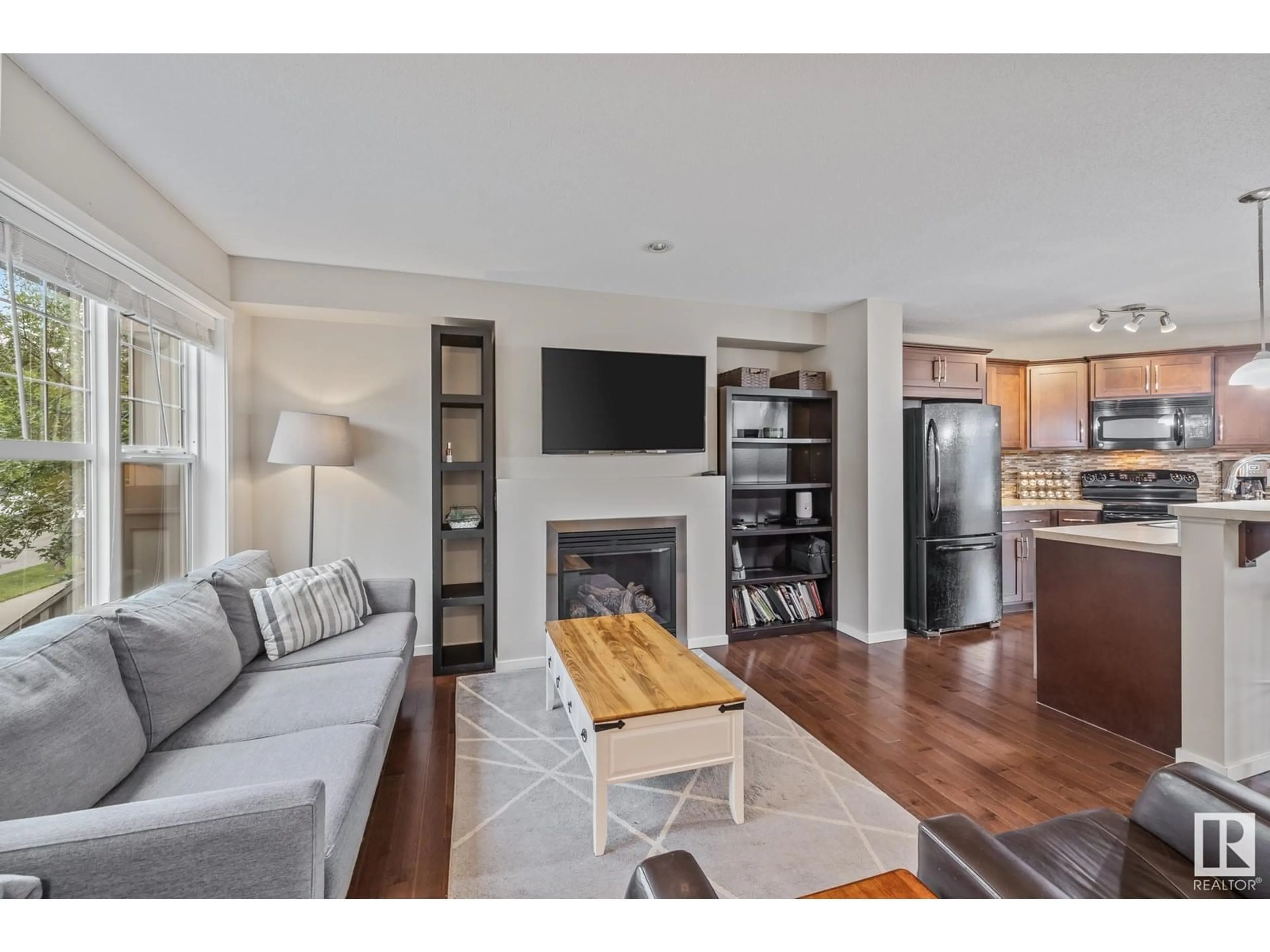Living room with furniture, wood/laminate floor for 2921 19 AV, Edmonton Alberta T6T0N6