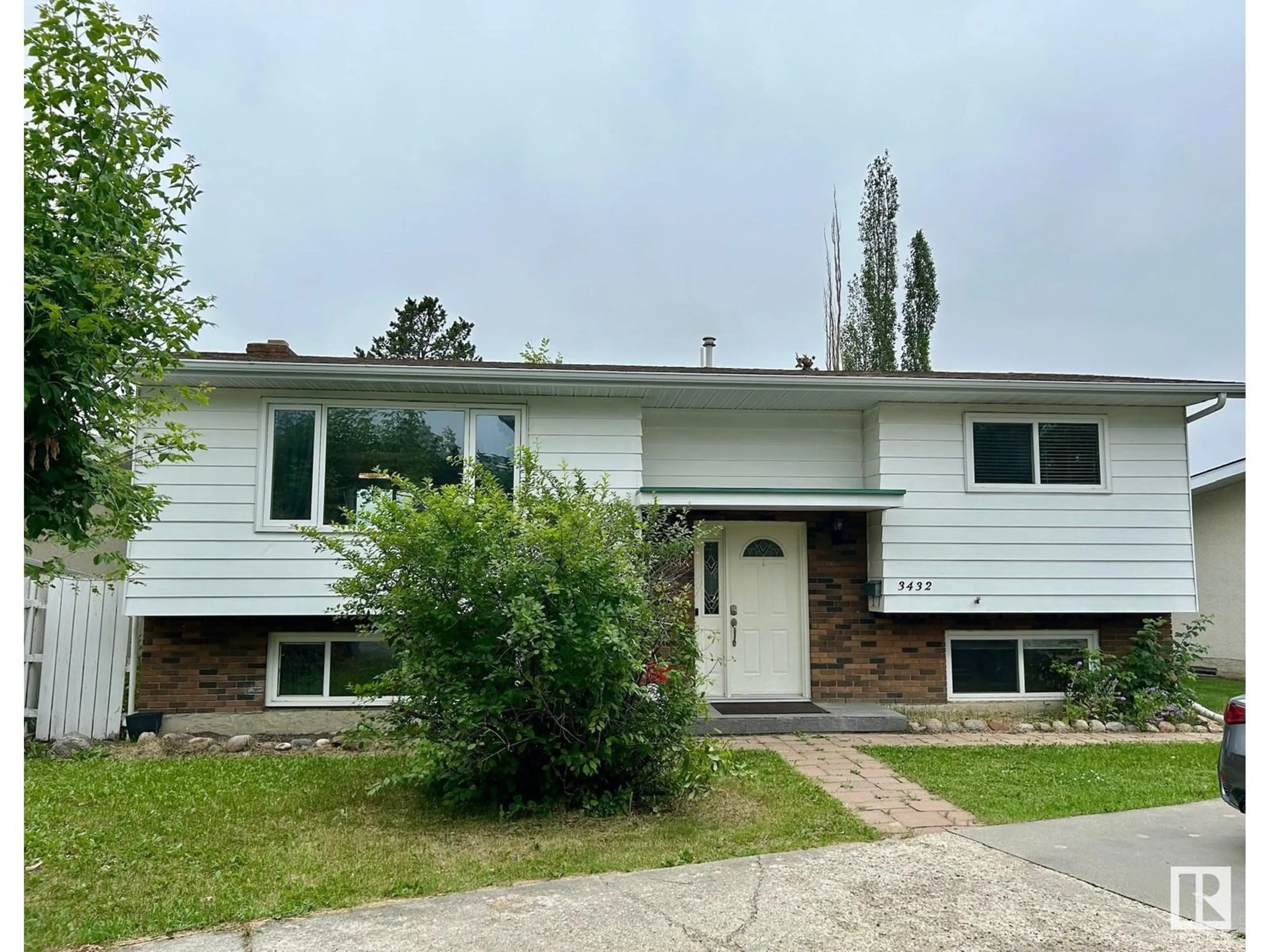 Home with vinyl exterior material, street for 3432 81 ST, Edmonton Alberta T6K0G4