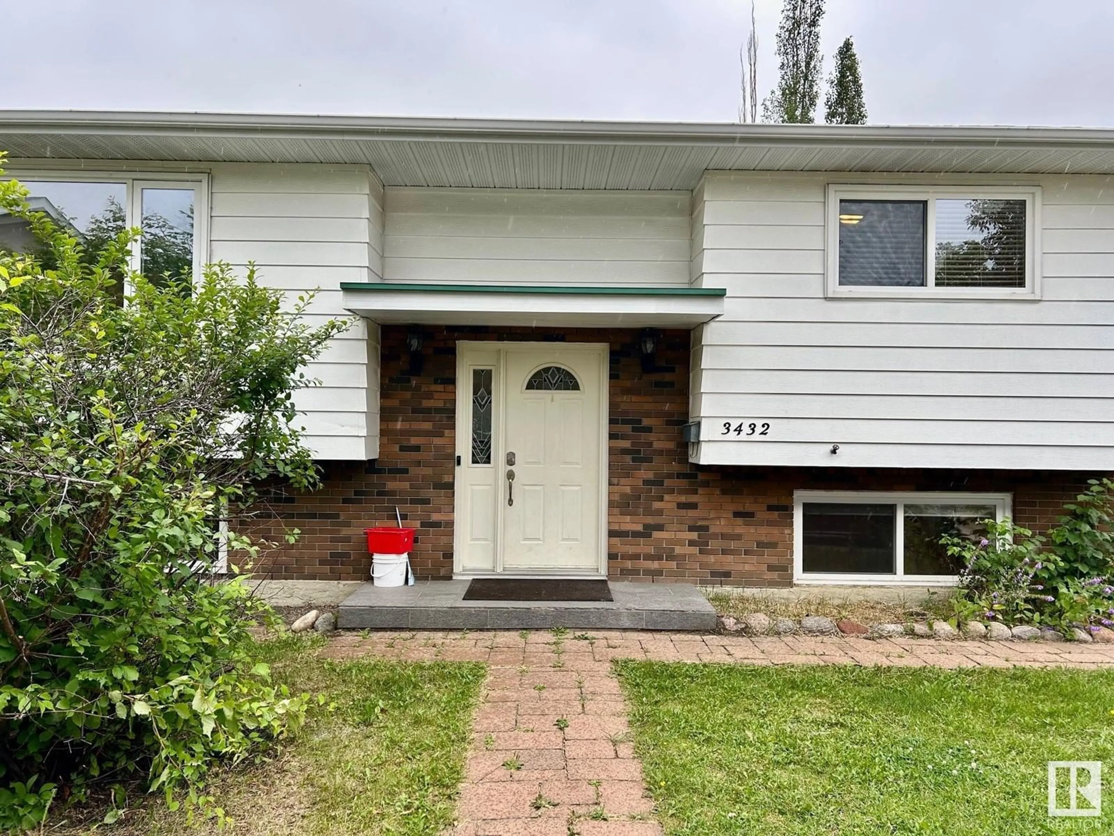 Home with vinyl exterior material, street for 3432 81 ST, Edmonton Alberta T6K0G4