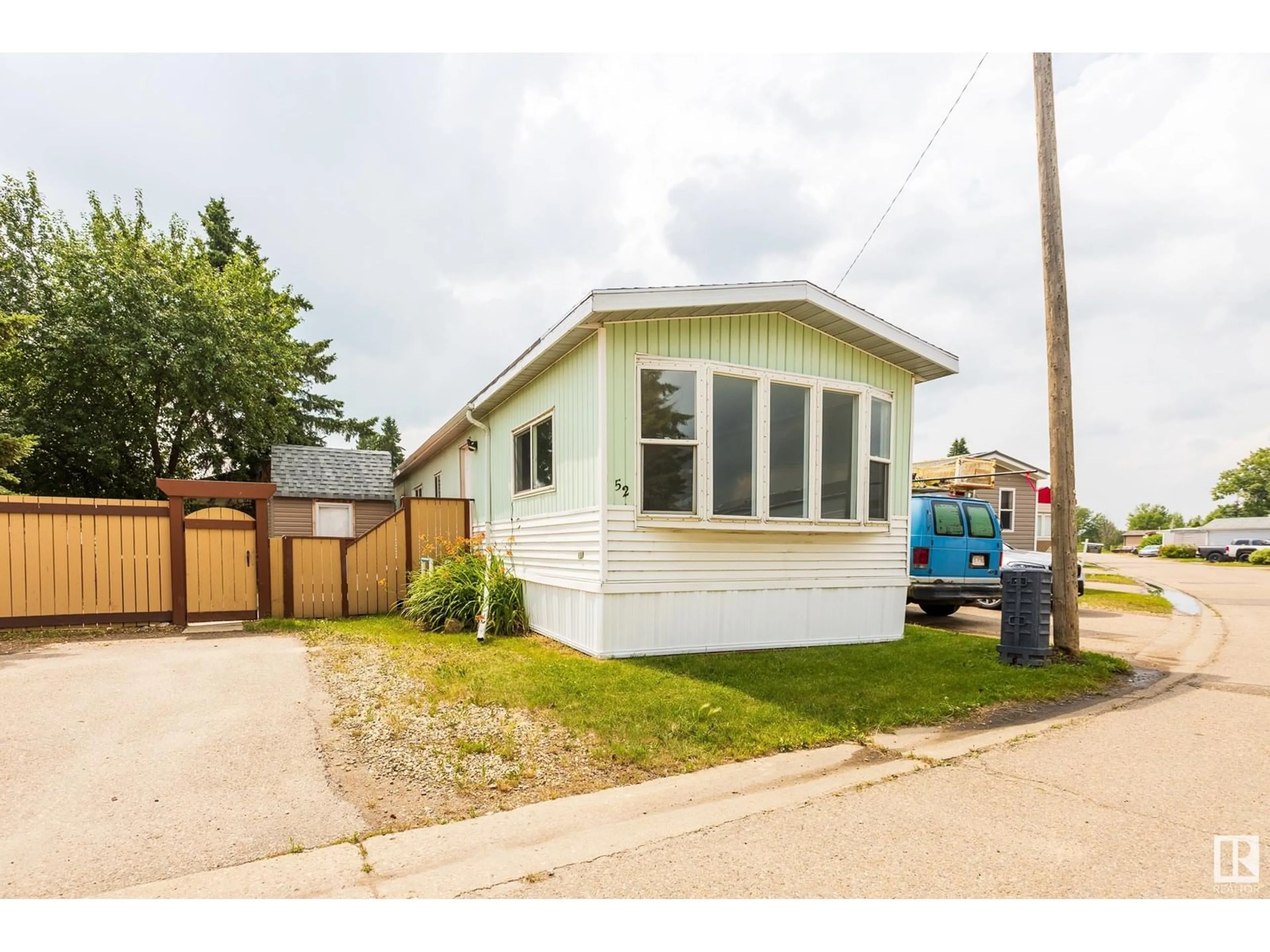 Home with vinyl exterior material, street for 52 - 10410 101 A ST, Morinville Alberta T8R1B1