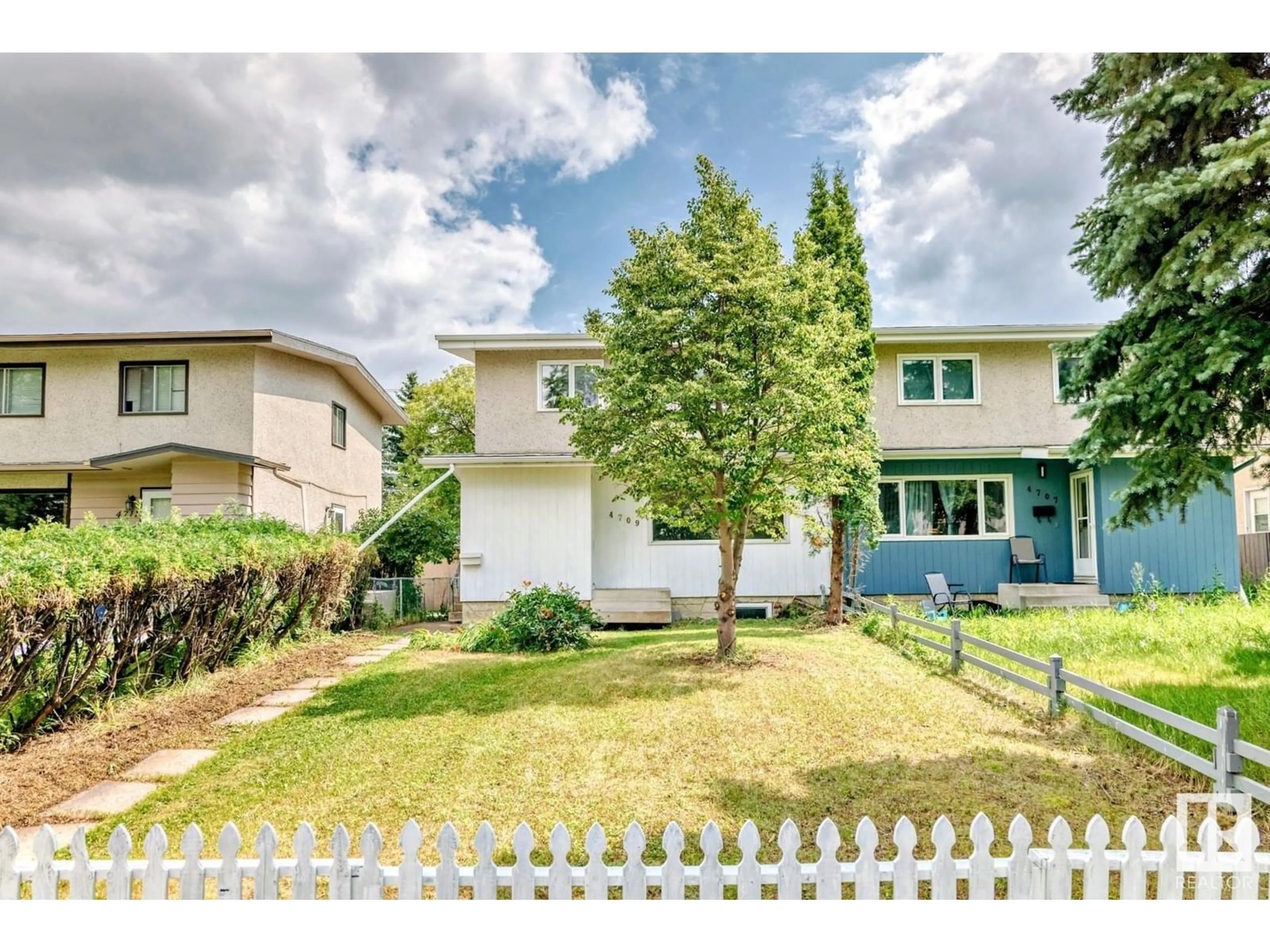 Home with vinyl exterior material, street for 4709 106 ST, Edmonton Alberta T6J2S7