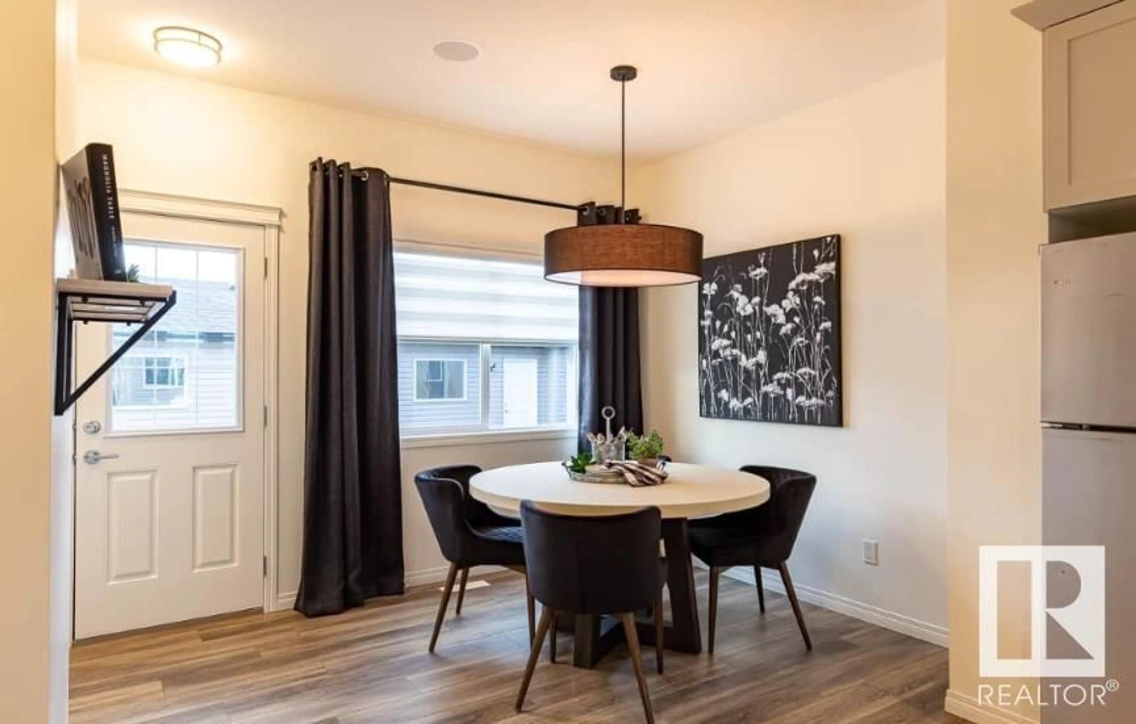 Dining room, wood/laminate floor for 92 DANSEREAU WY, Beaumont Alberta T4X3E2