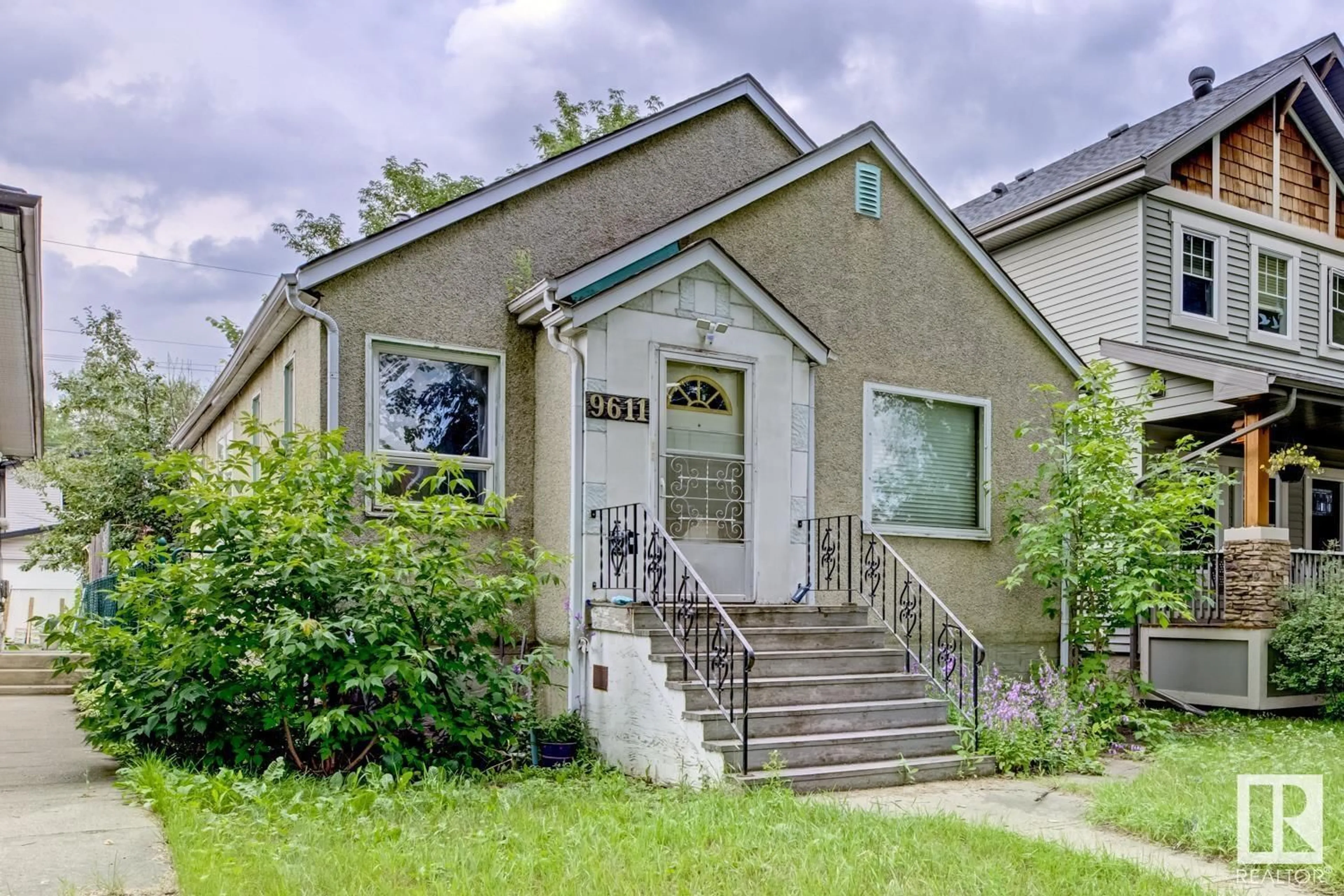 Home with vinyl exterior material, street for 9611 81 AV, Edmonton Alberta T6C0X6