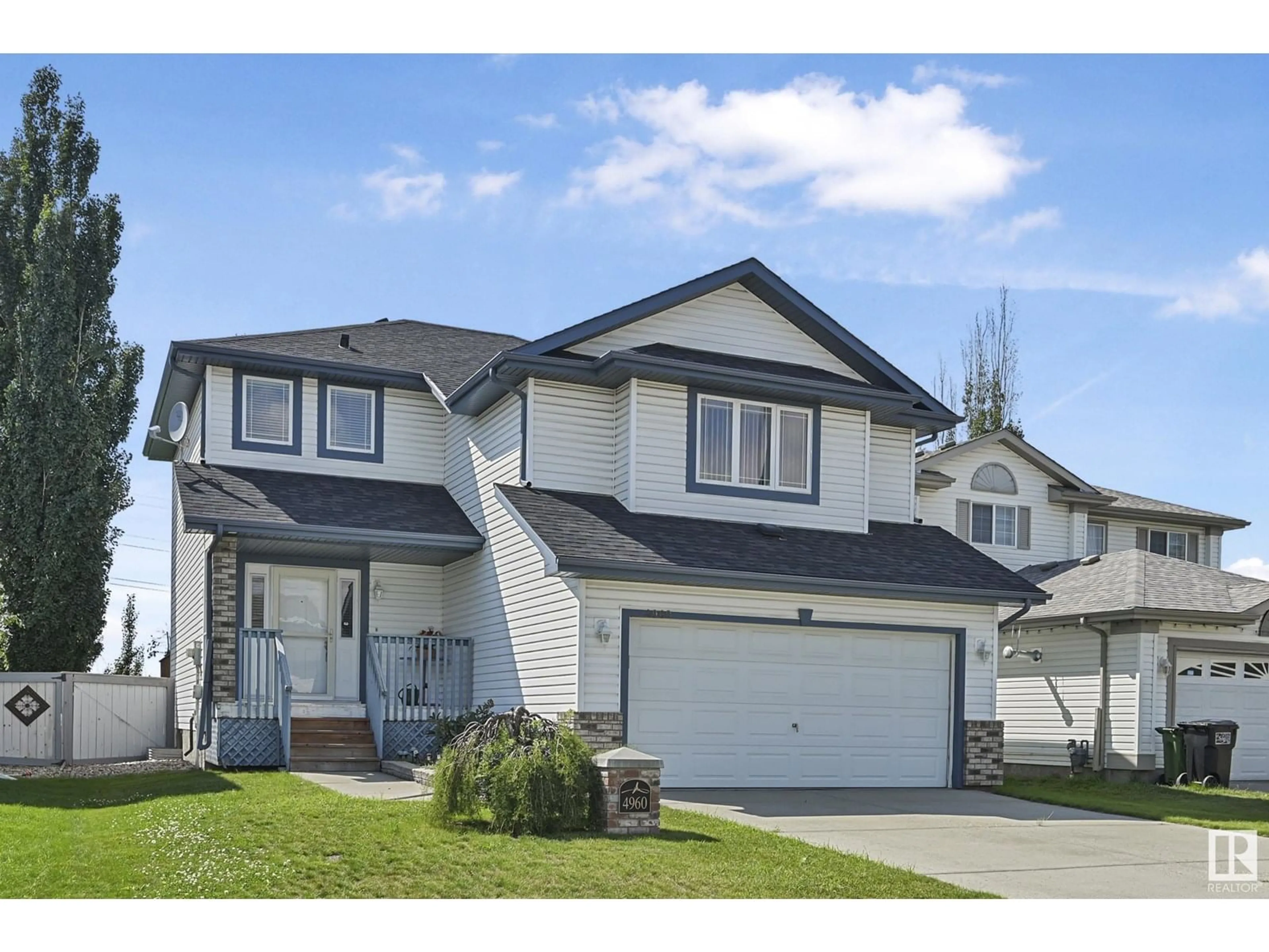 Home with vinyl exterior material, street for NW - 4960 191 ST, Edmonton Alberta T6M2T8