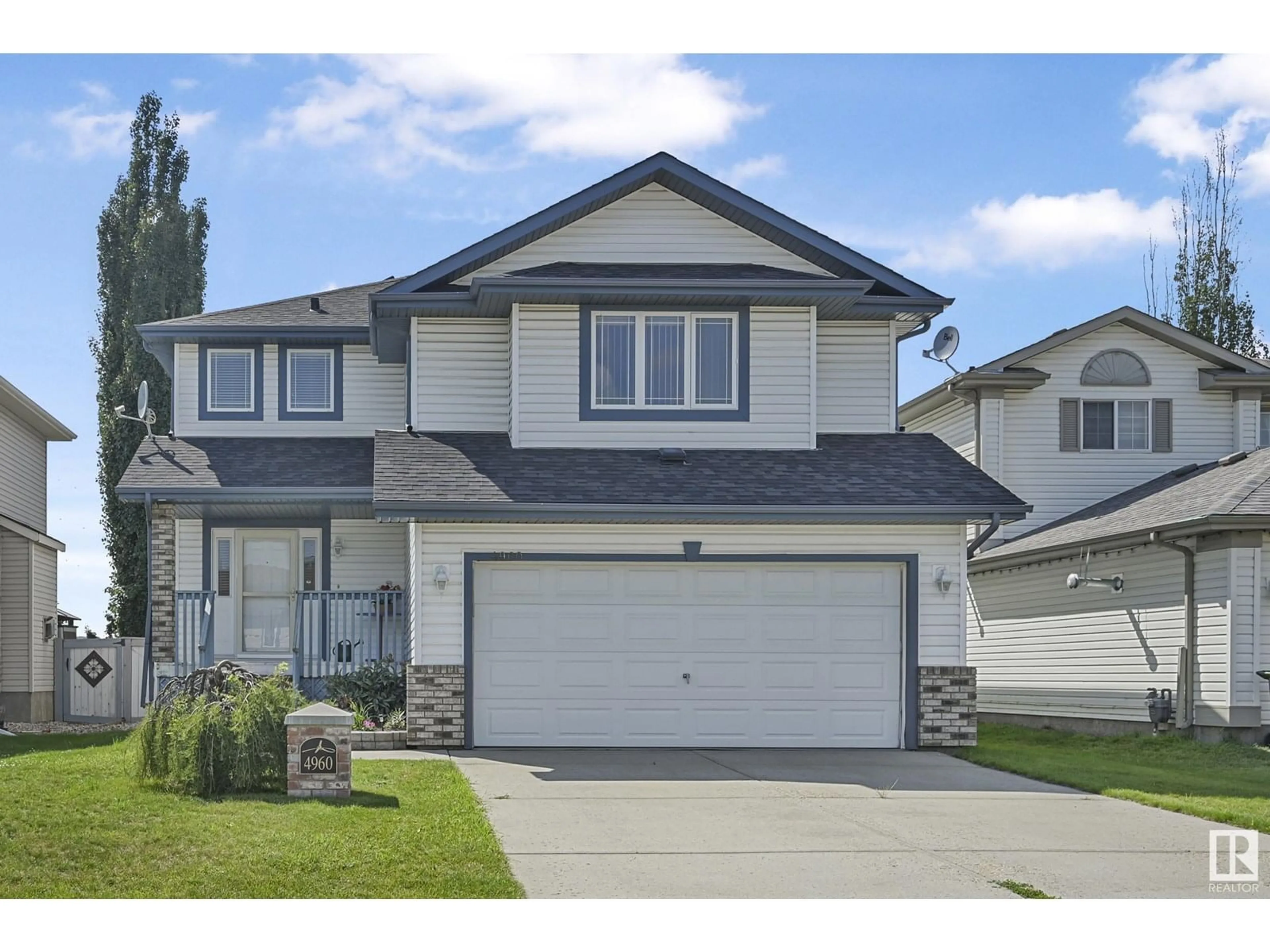 Home with vinyl exterior material, street for NW - 4960 191 ST, Edmonton Alberta T6M2T8