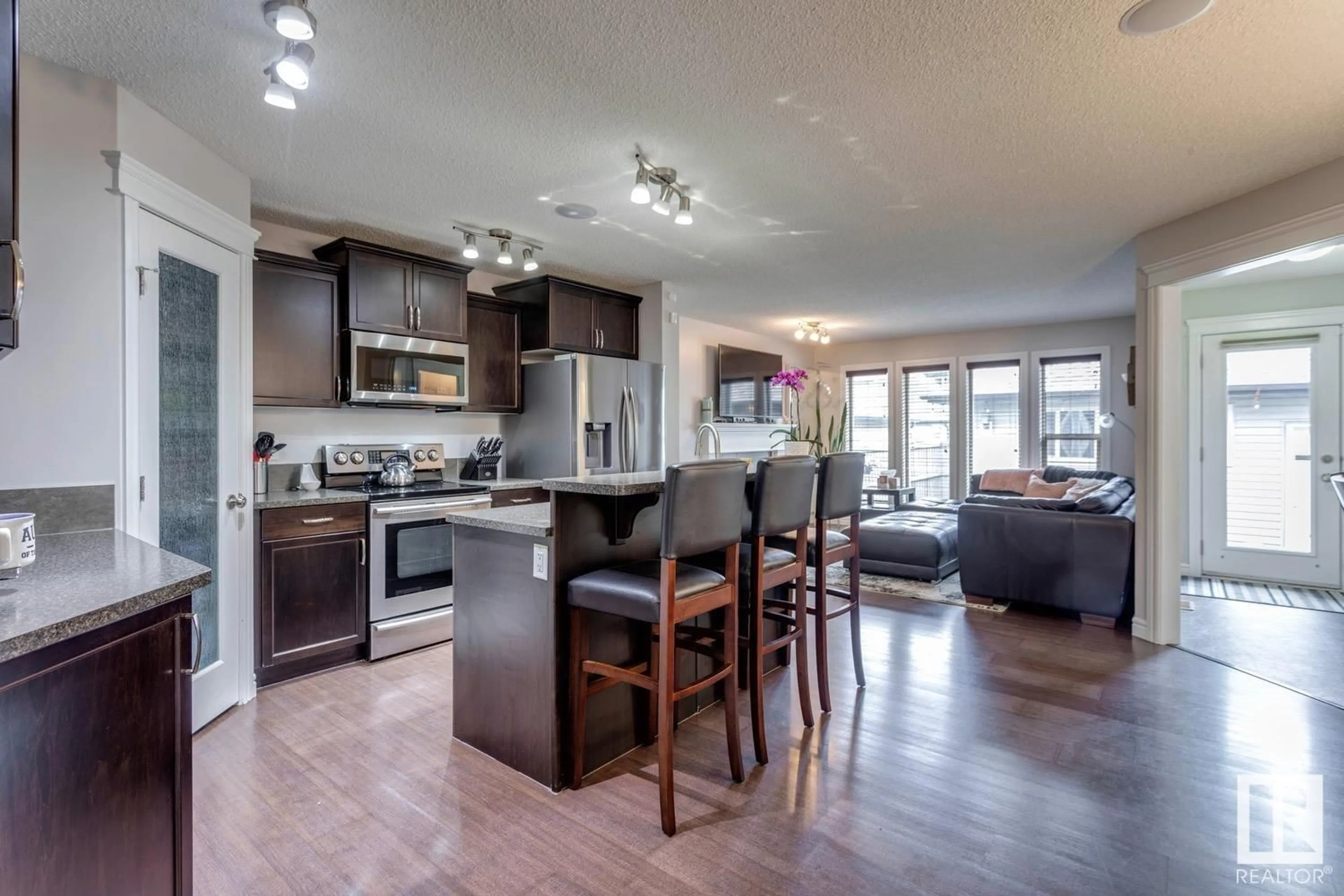 Open concept kitchen, wood/laminate floor for 2419 AUSTIN CR, Edmonton Alberta T6W0L3