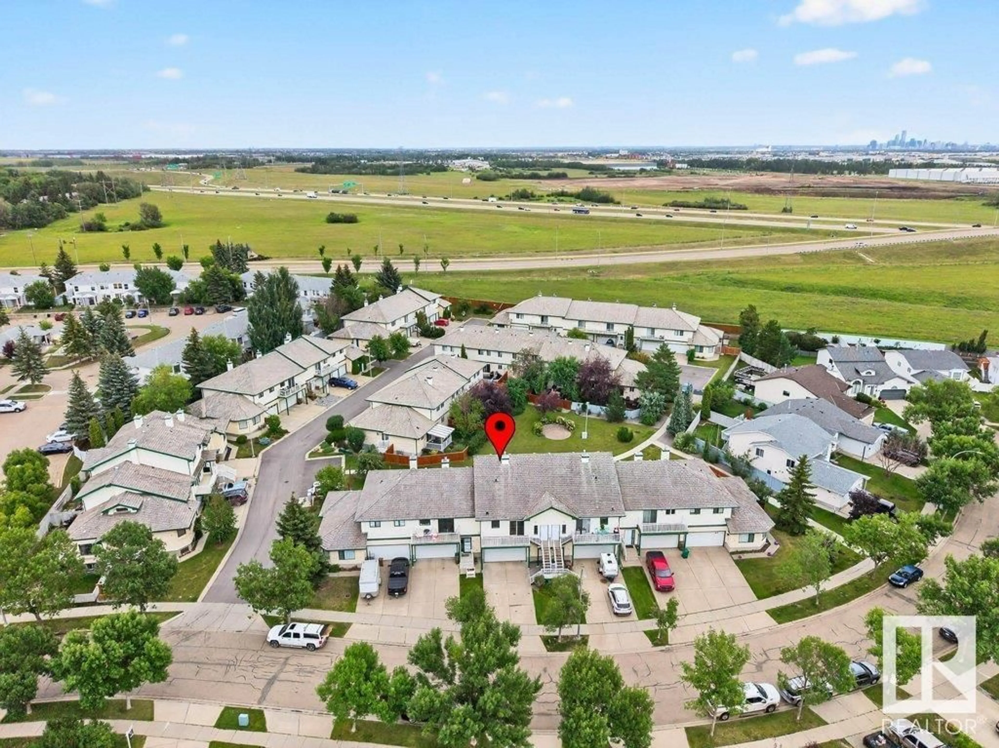A pic from outside/outdoor area/front of a property/back of a property/a pic from drone, mountain view for 11 - 7 HUNCHAK WY, St. Albert Alberta T8N6P2