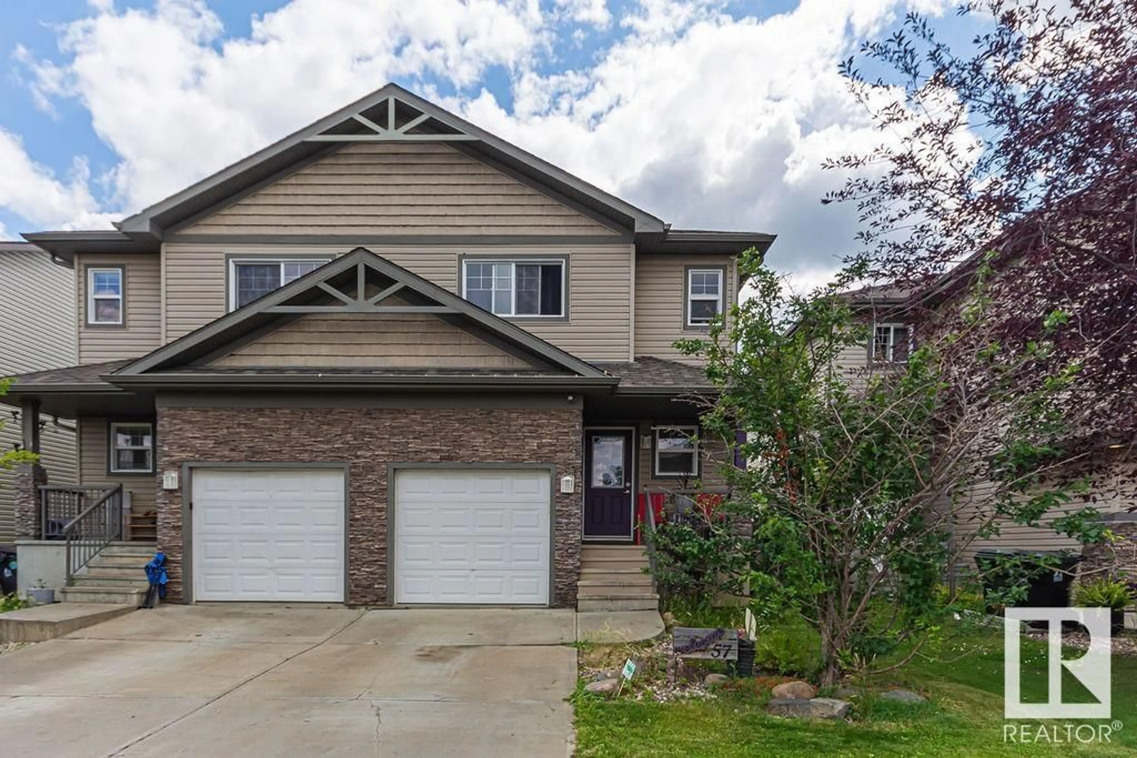 Home with vinyl exterior material, street for 57 HARTWICK LO, Spruce Grove Alberta T7X0A5