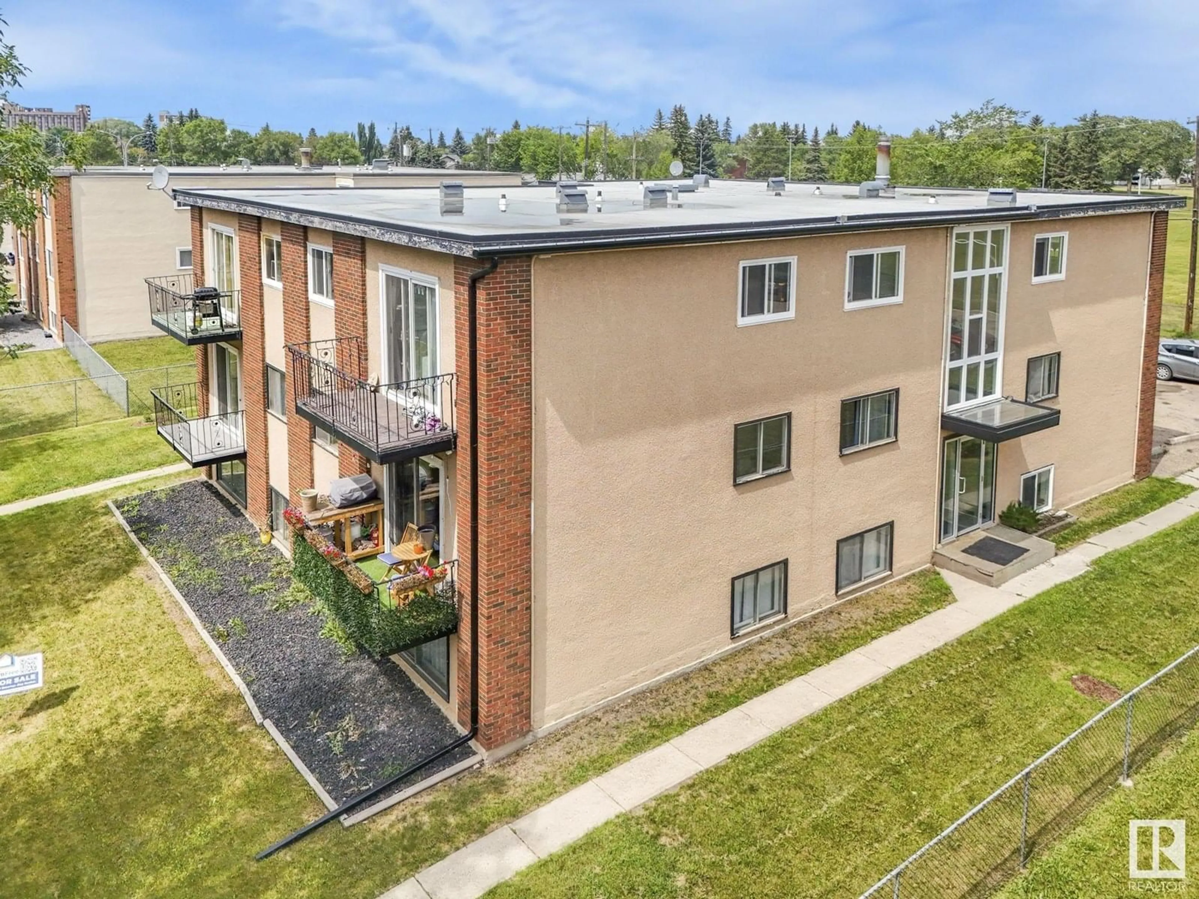 A pic from outside/outdoor area/front of a property/back of a property/a pic from drone, building for #103 - 15930 109 AV, Edmonton Alberta T5P1B7