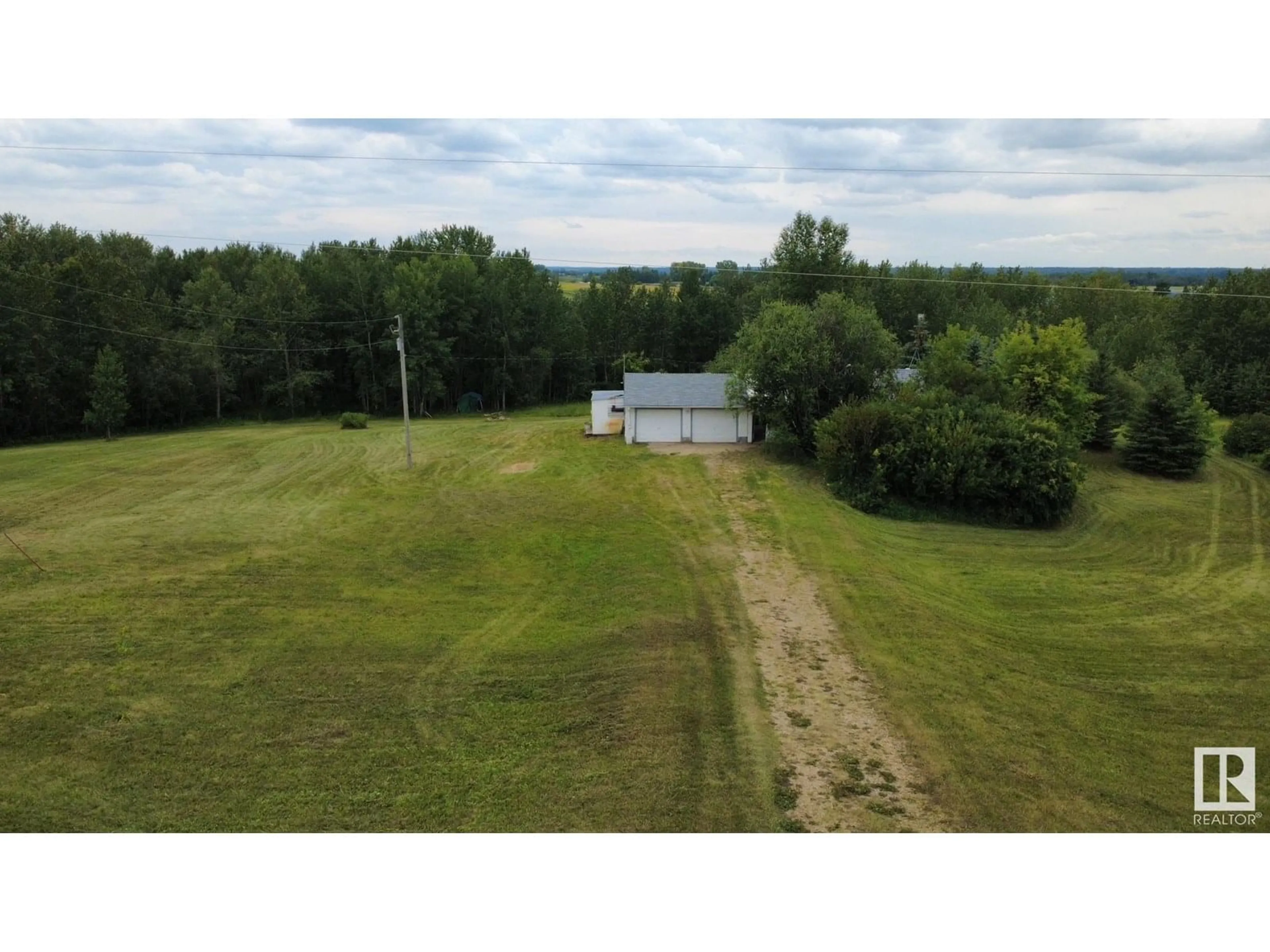 A pic from outside/outdoor area/front of a property/back of a property/a pic from drone, unknown for 20 23429 TWP ROAD ROAD, Rural Westlock County Alberta T0G1I0