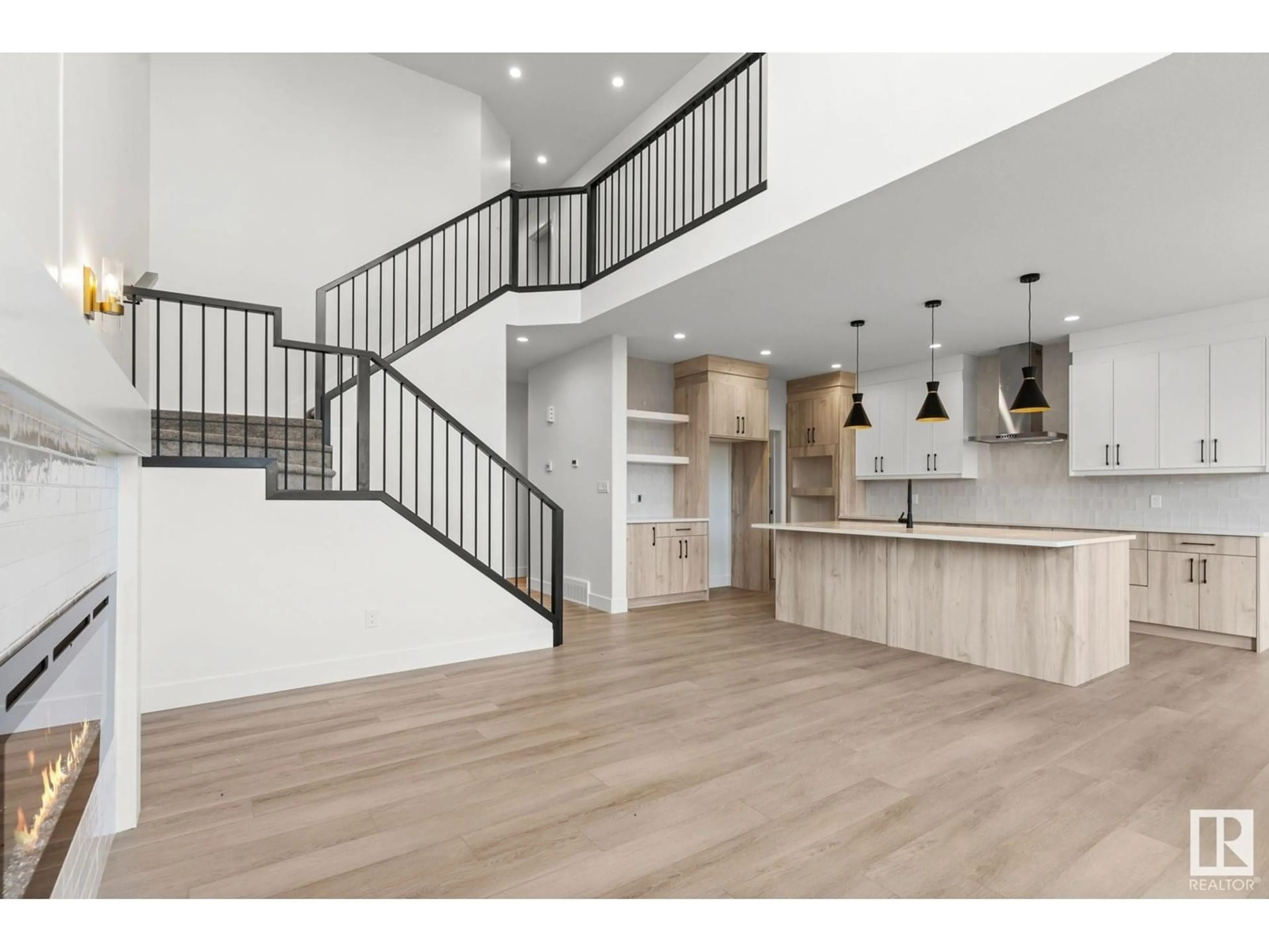 Open concept kitchen, wood/laminate floor for 3317 CHICKADEE DR, Edmonton Alberta T5S0V6