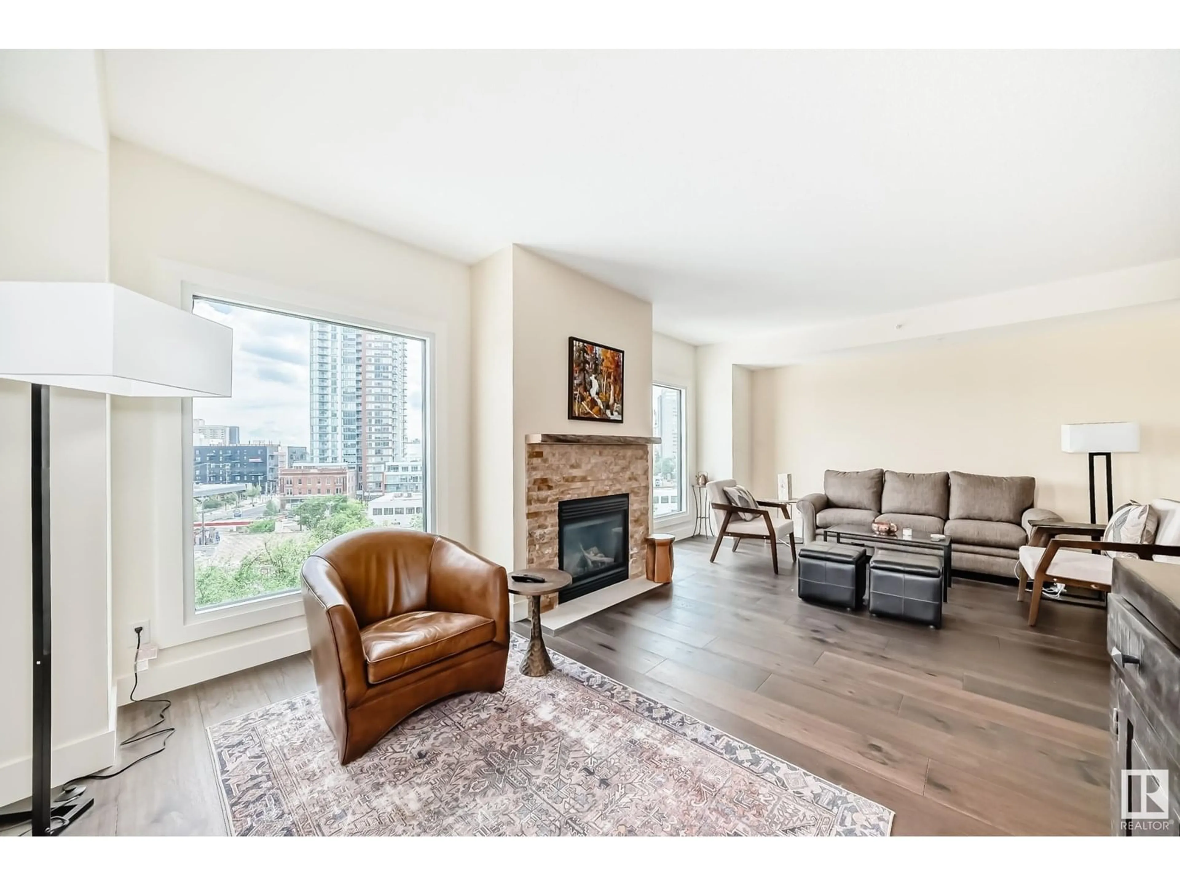 Living room with furniture, wood/laminate floor for 707 - 10108 125 ST, Edmonton Alberta T5N4B6