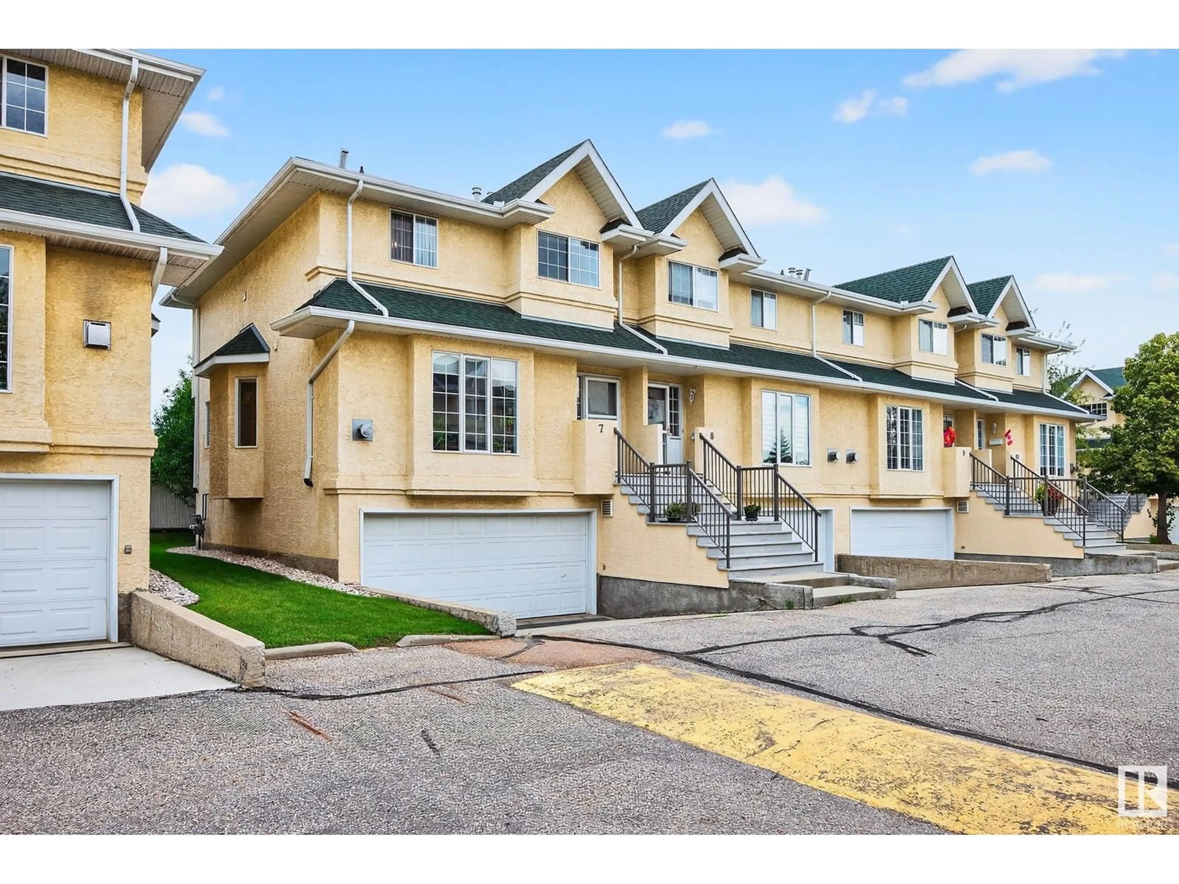 Home with vinyl exterior material, street for #7 - 2419 133 AV, Edmonton Alberta T5A5A5
