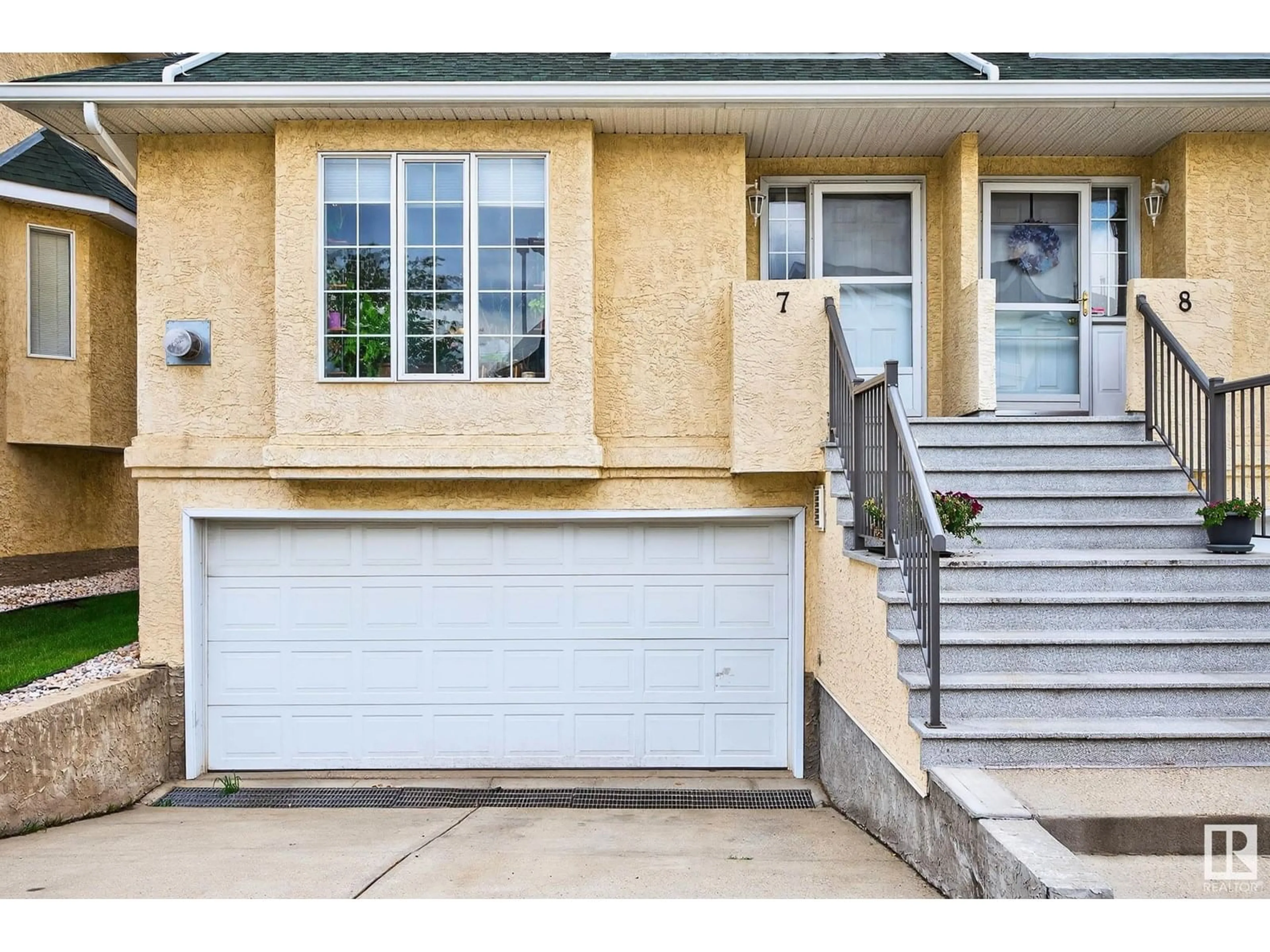 Home with vinyl exterior material, street for #7 - 2419 133 AV, Edmonton Alberta T5A5A5