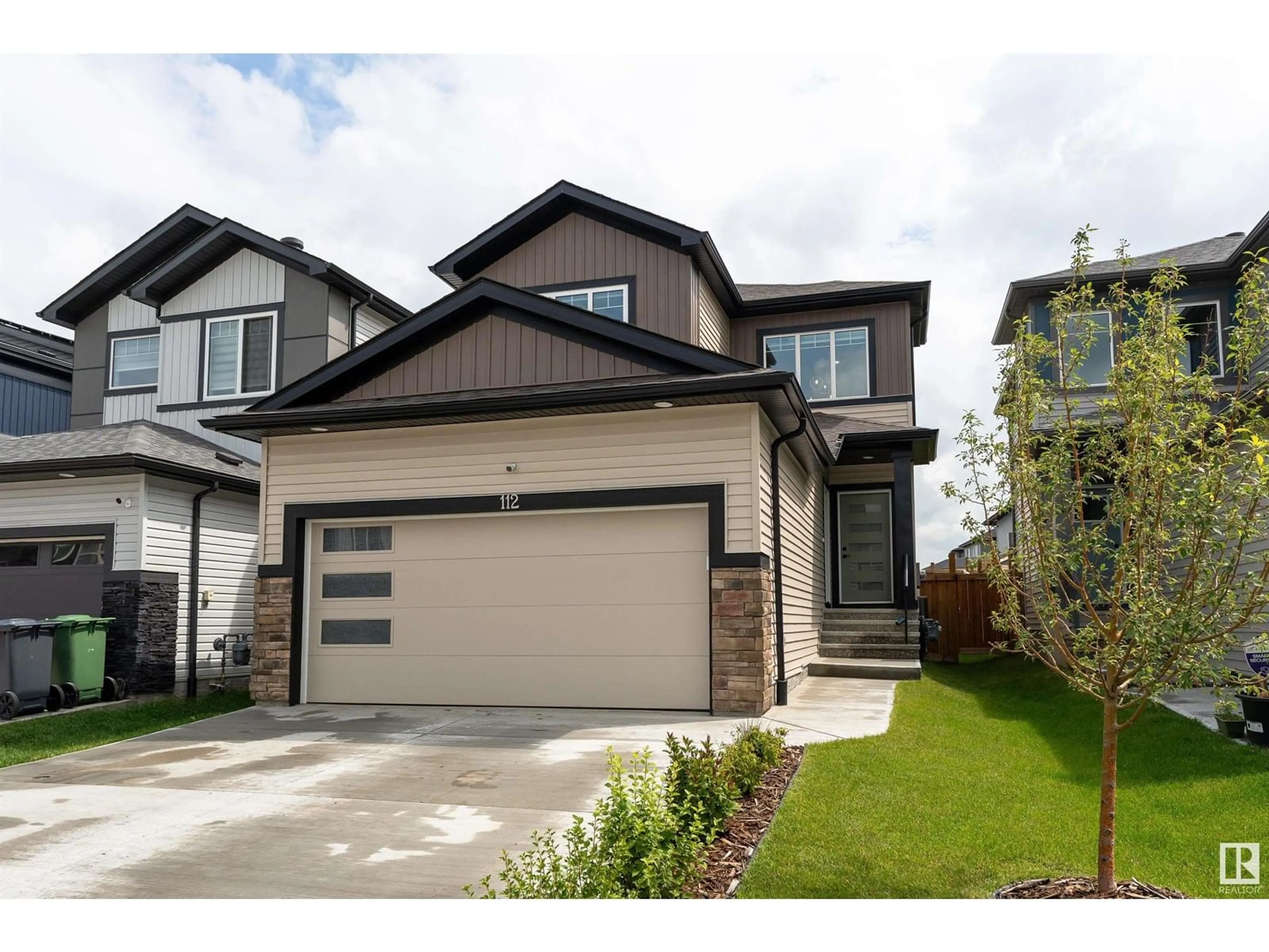 Home with vinyl exterior material, street for 112 BLUFF CV, Leduc Alberta T9E1M8