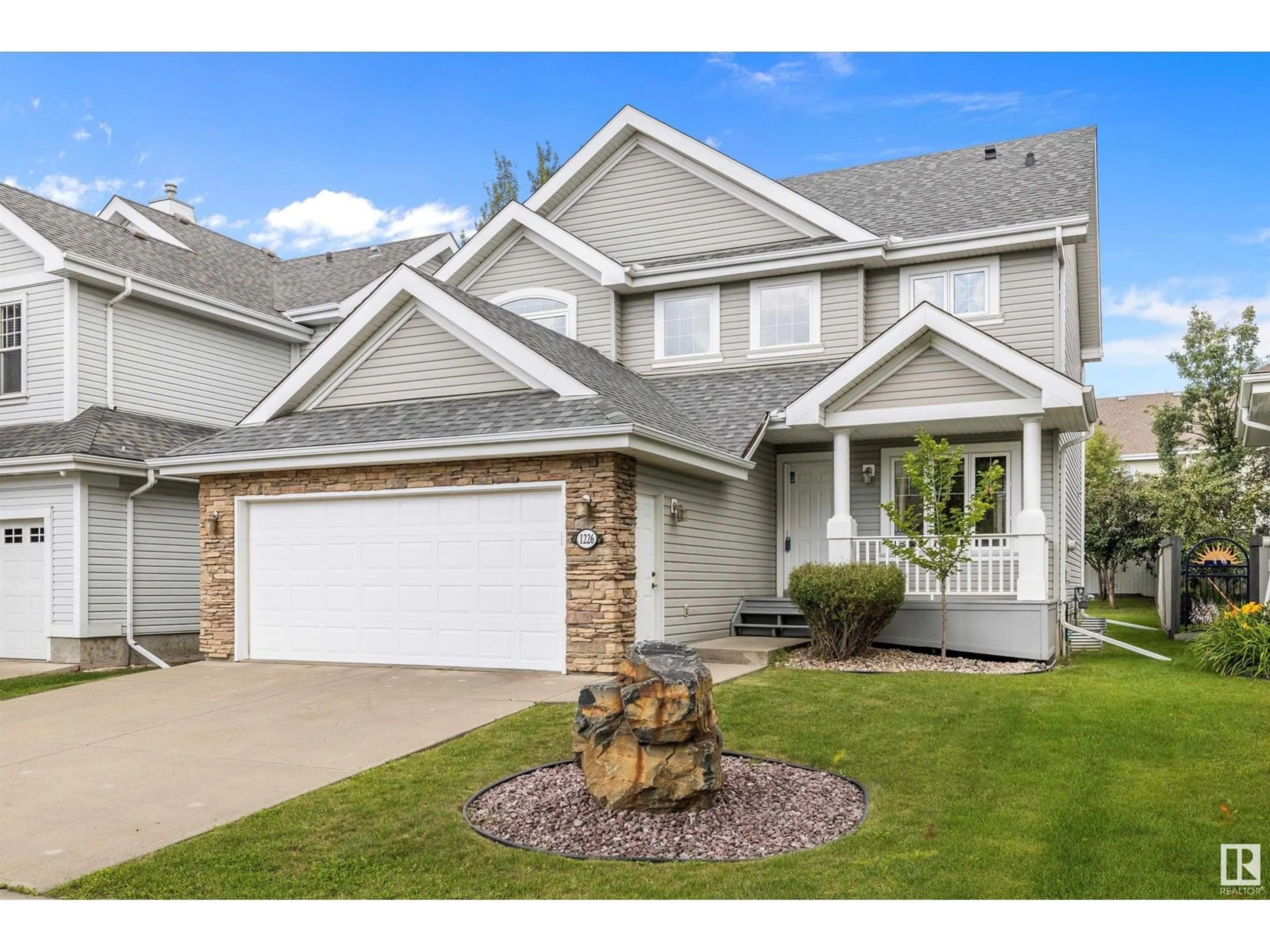 Home with vinyl exterior material, street for 1226 SUMMERSIDE DR, Edmonton Alberta T6X1B4