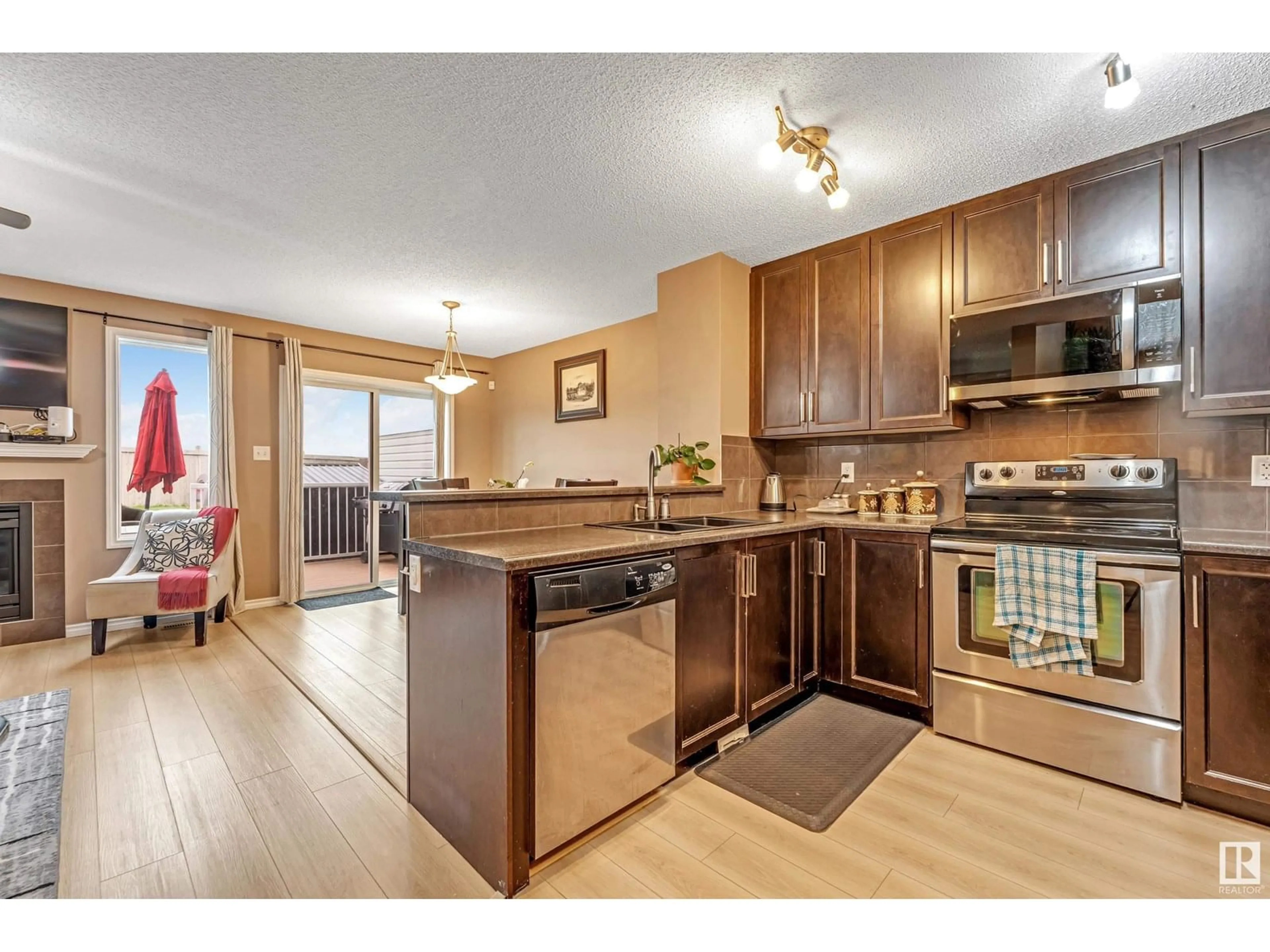 Open concept kitchen, wood/laminate floor for 2845 18A AV, Edmonton Alberta T6T0N8