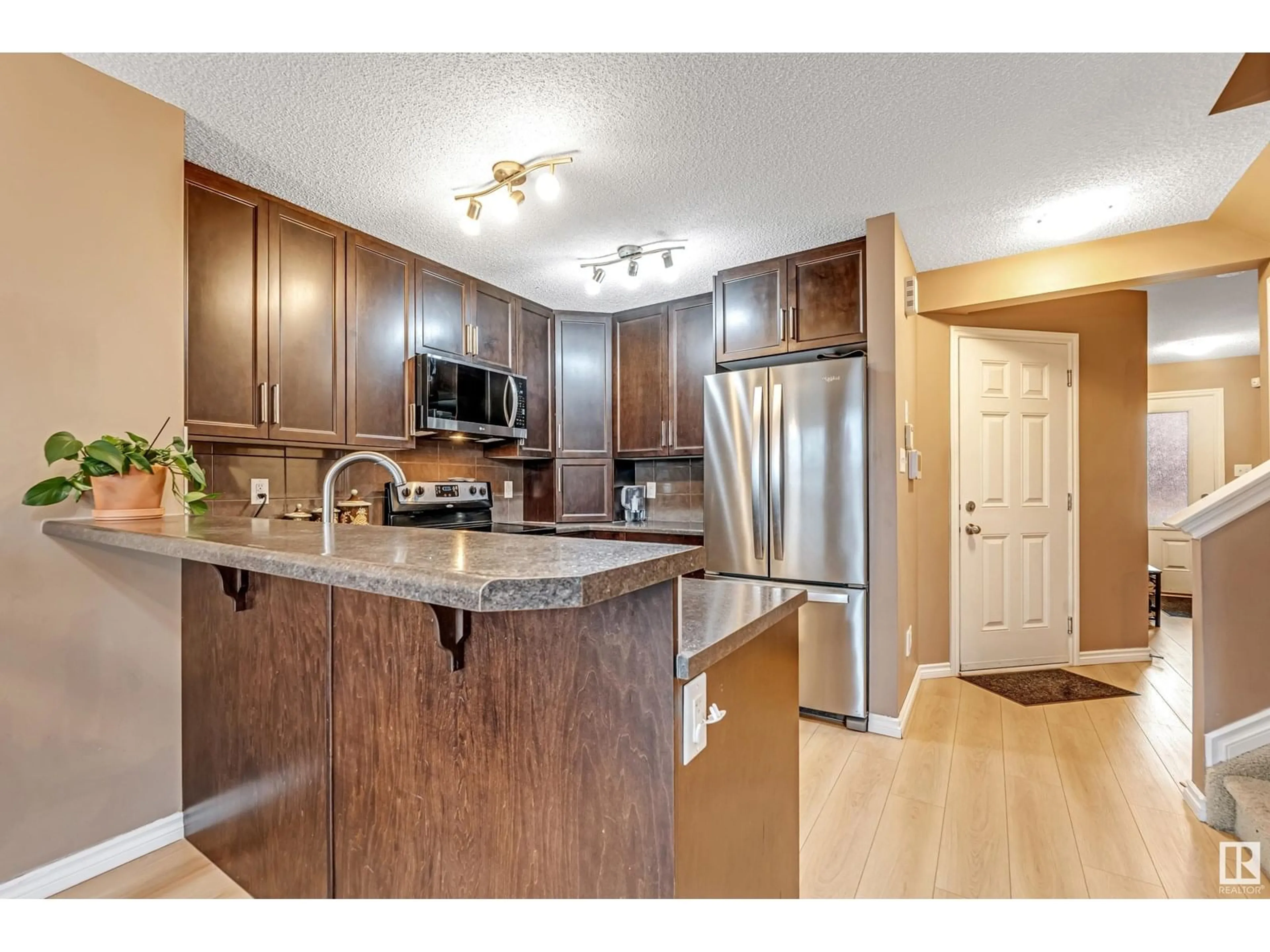 Open concept kitchen, wood/laminate floor for 2845 18A AV, Edmonton Alberta T6T0N8