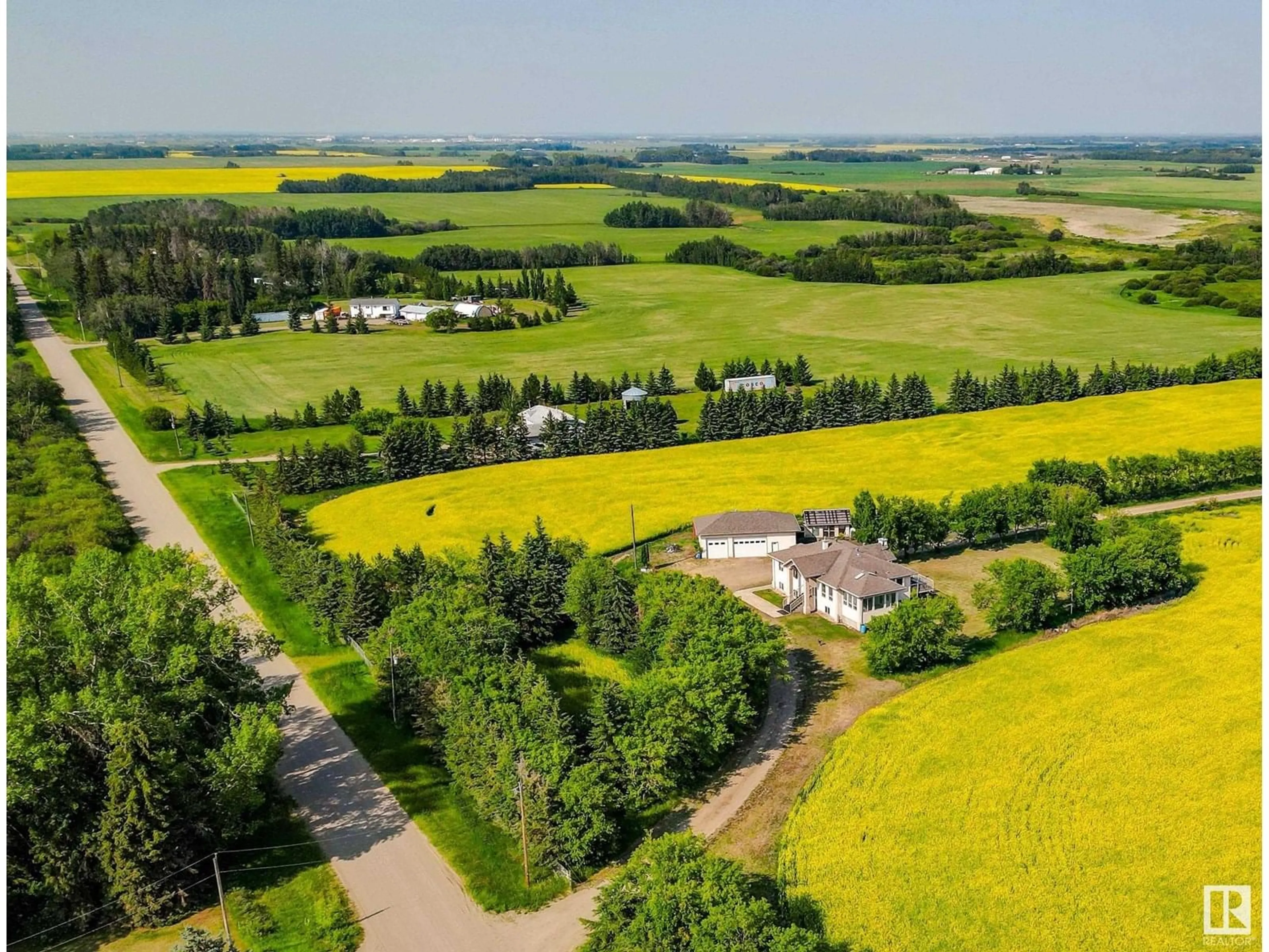 A pic from outside/outdoor area/front of a property/back of a property/a pic from drone, unknown for 55023 RGE ROAD 254, Rural Sturgeon County Alberta T8T0T2