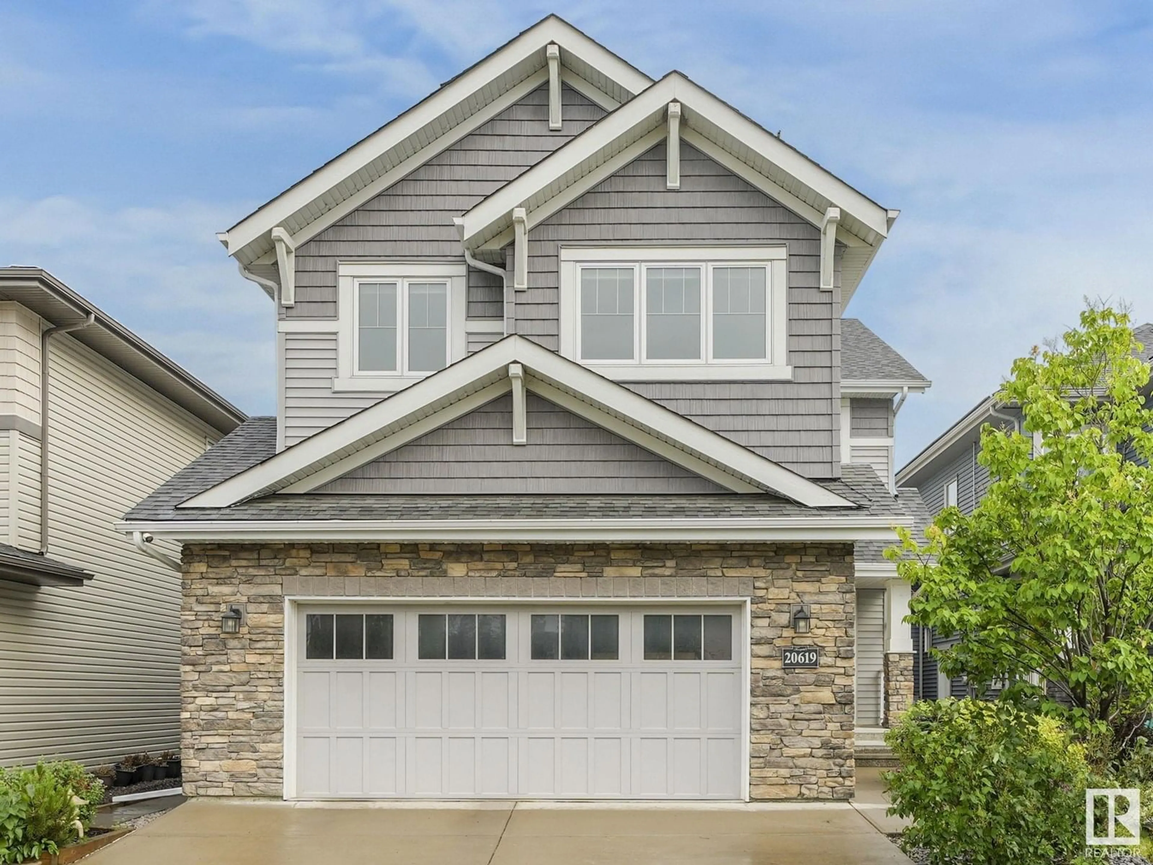 Home with vinyl exterior material, street for NW - 20619 130 AV, Edmonton Alberta T5S0J4