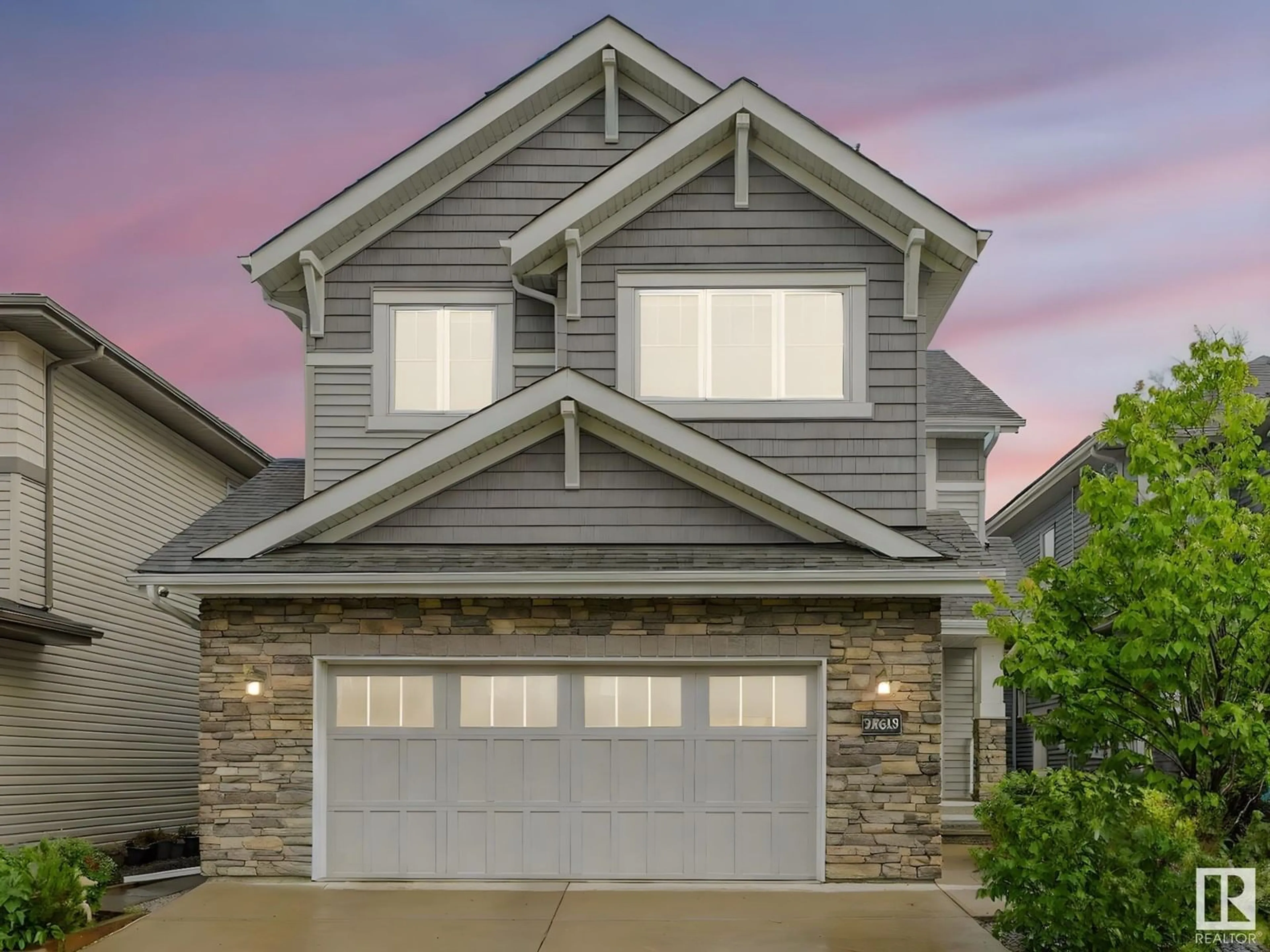 Home with vinyl exterior material, street for NW - 20619 130 AV, Edmonton Alberta T5S0J4
