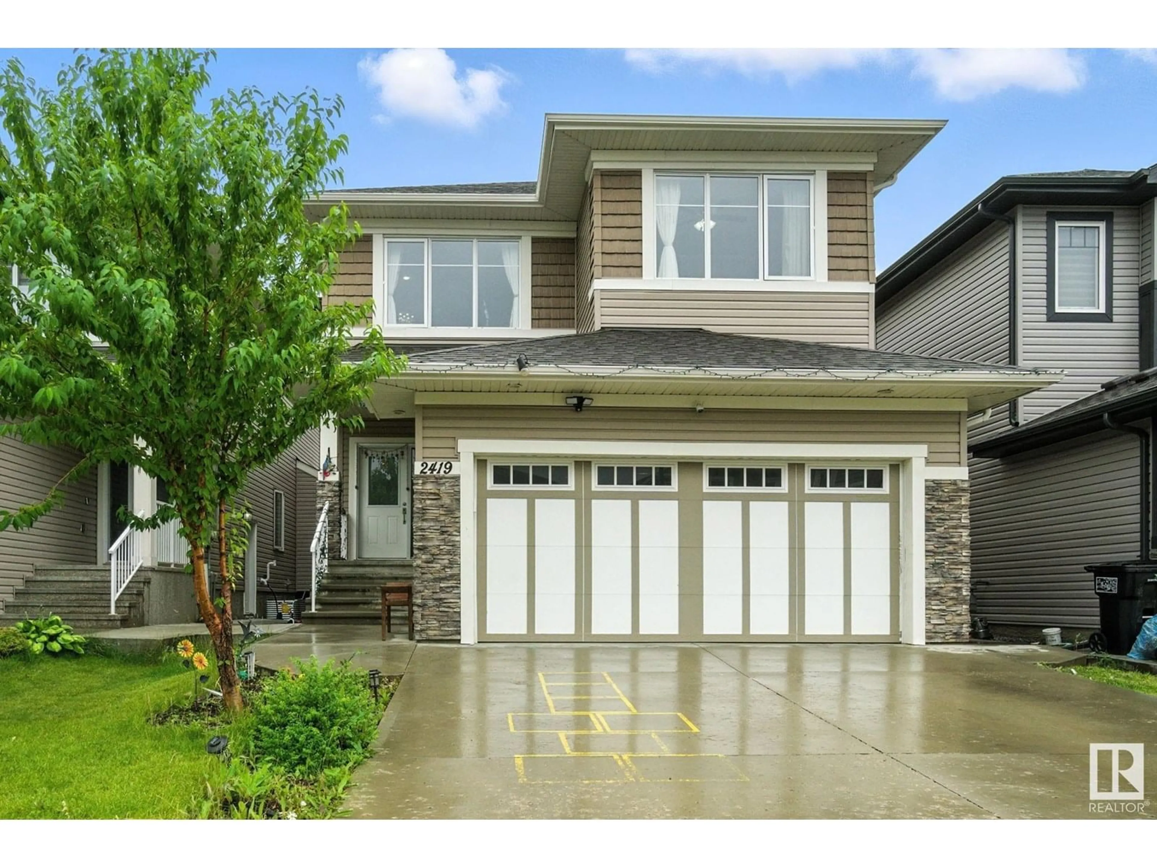 Home with vinyl exterior material, street for 2419 17 AV, Edmonton Alberta T6T2G8