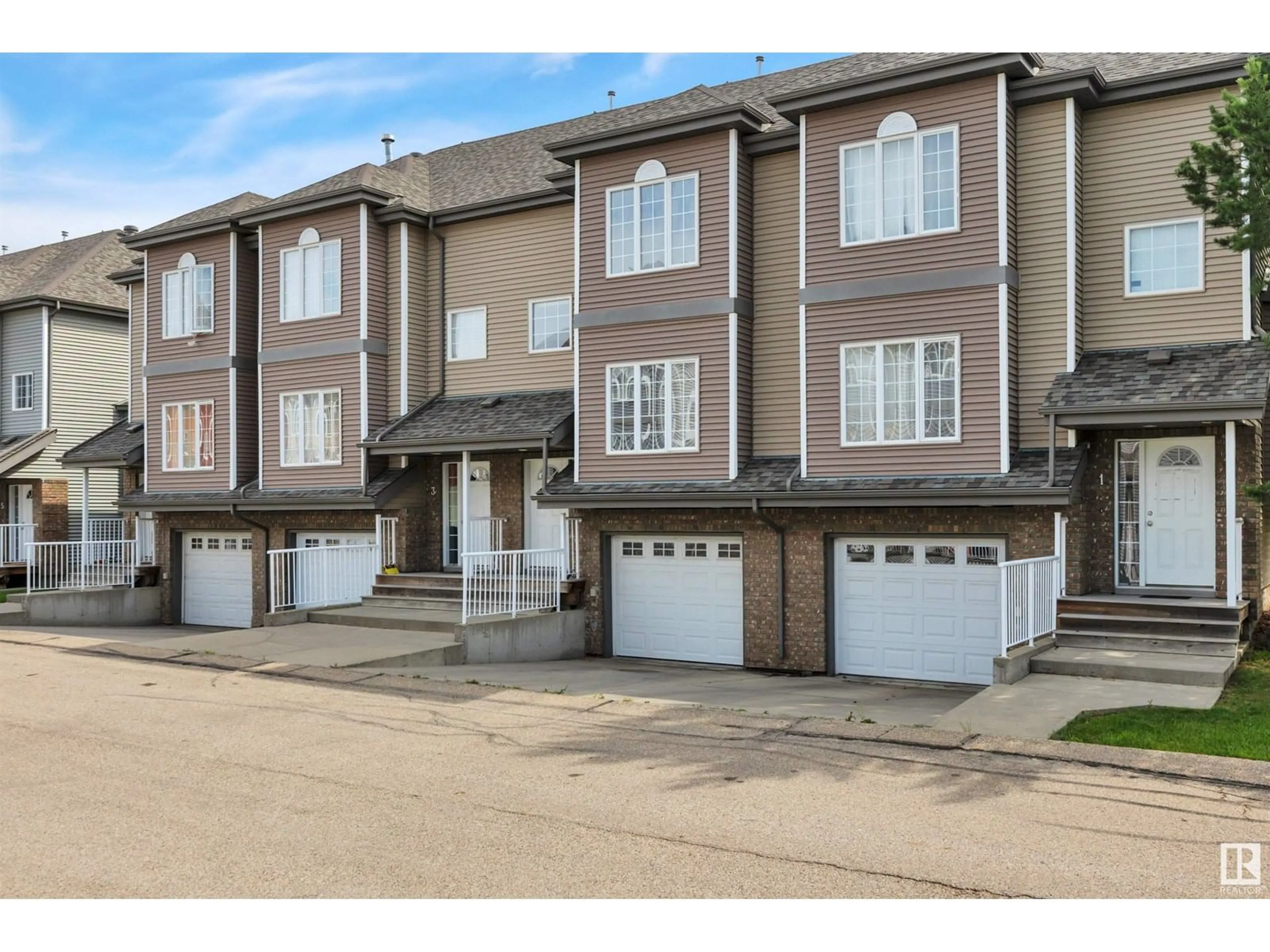 A pic from outside/outdoor area/front of a property/back of a property/a pic from drone, street for #2 - 5102 30 AV, Beaumont Alberta T4X0A9