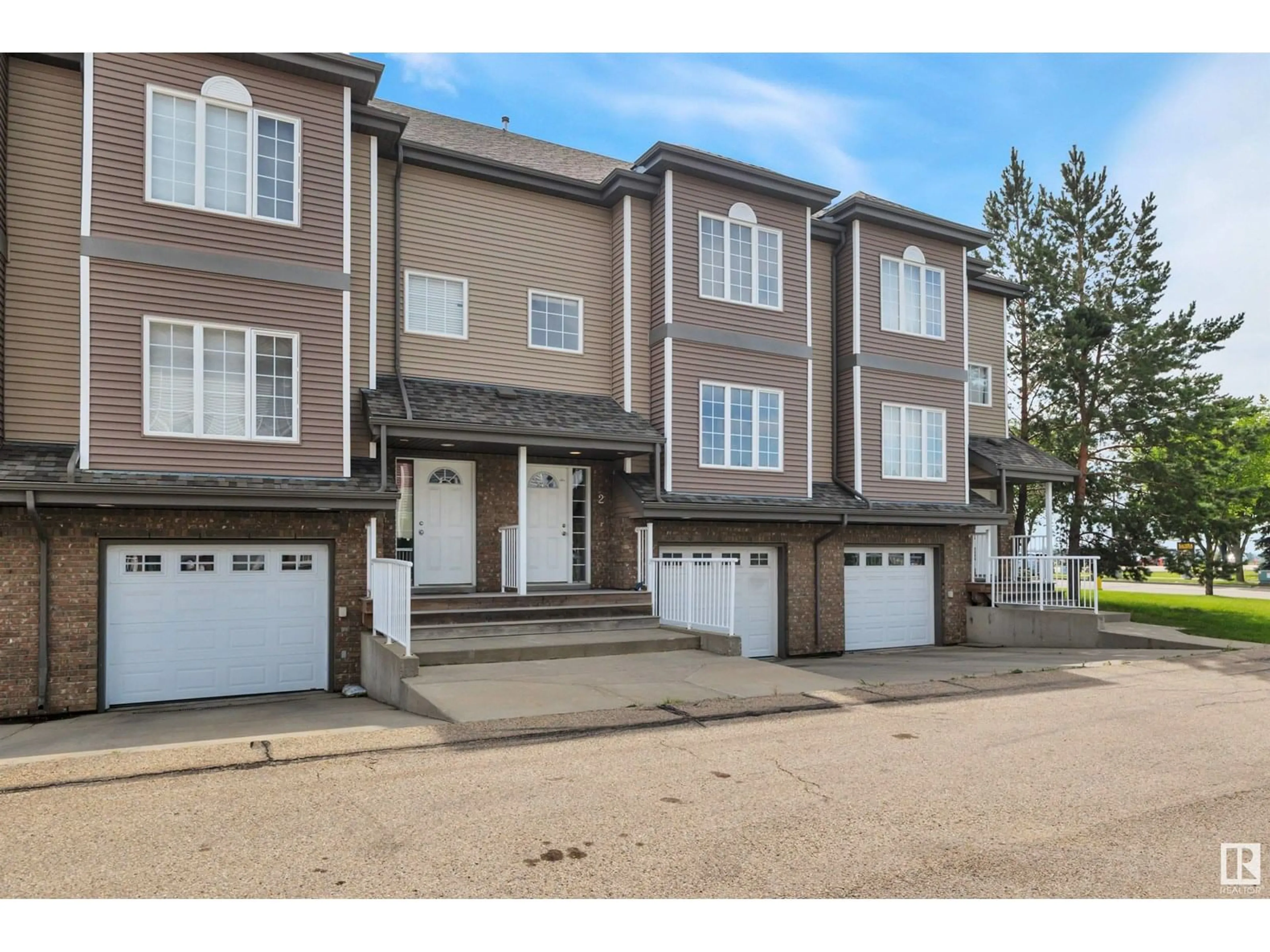 A pic from outside/outdoor area/front of a property/back of a property/a pic from drone, street for #2 - 5102 30 AV, Beaumont Alberta T4X0A9