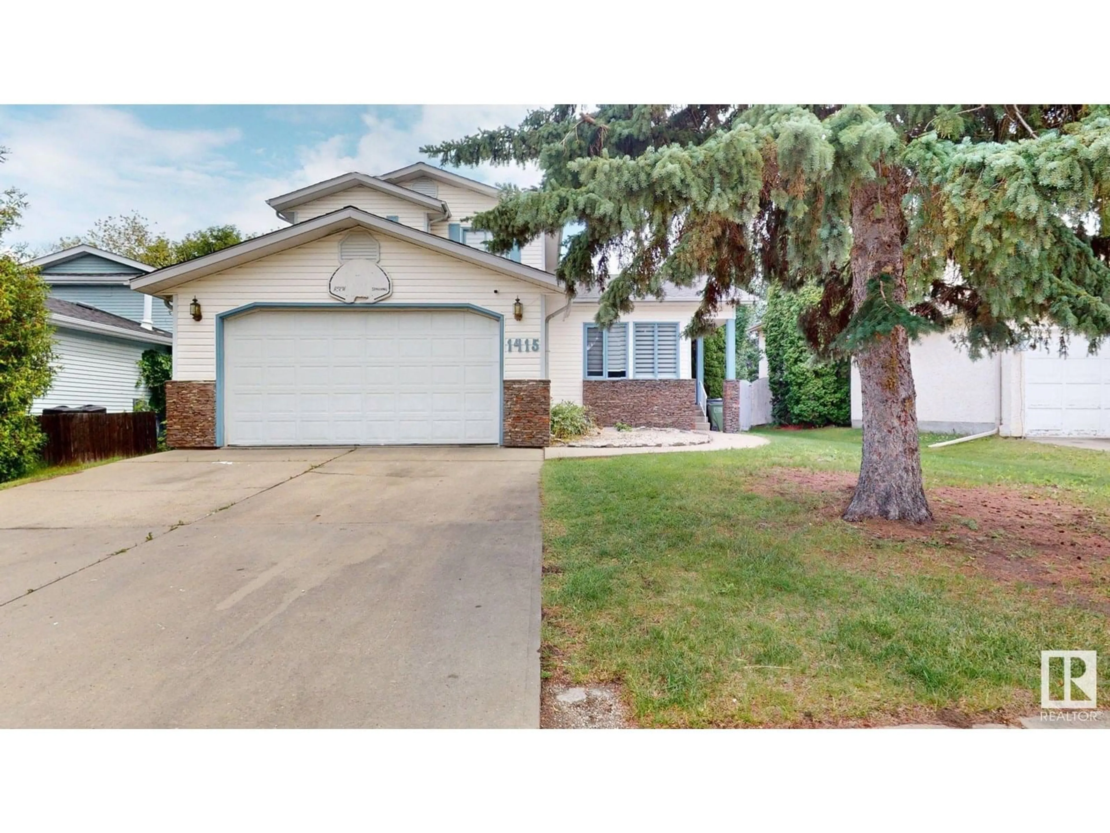 Home with vinyl exterior material, street for 1415 49A ST, Edmonton Alberta T6L6H6