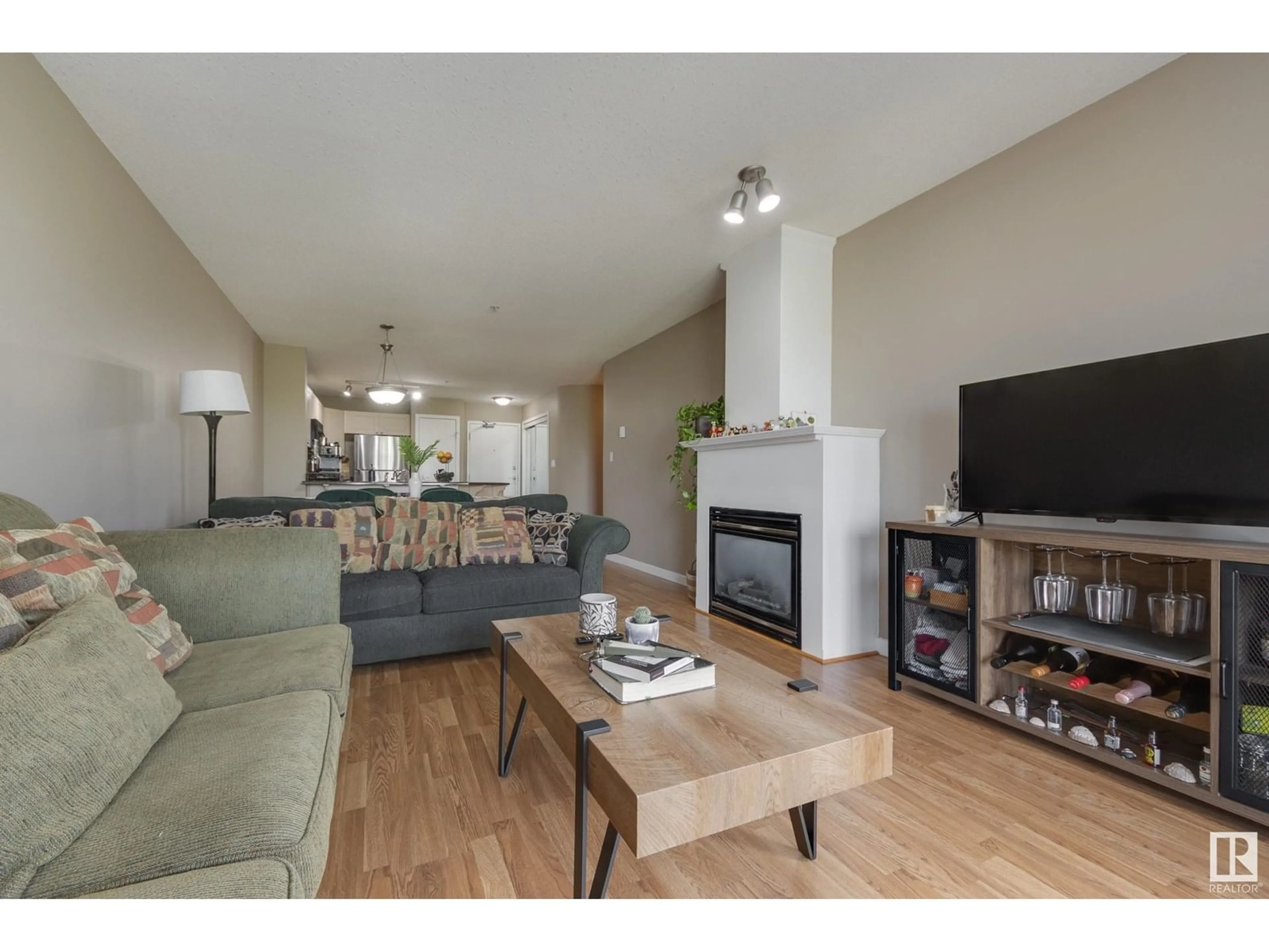 Living room with furniture, wood/laminate floor for #314 - 4312 139 AV, Edmonton Alberta T5Y3J4