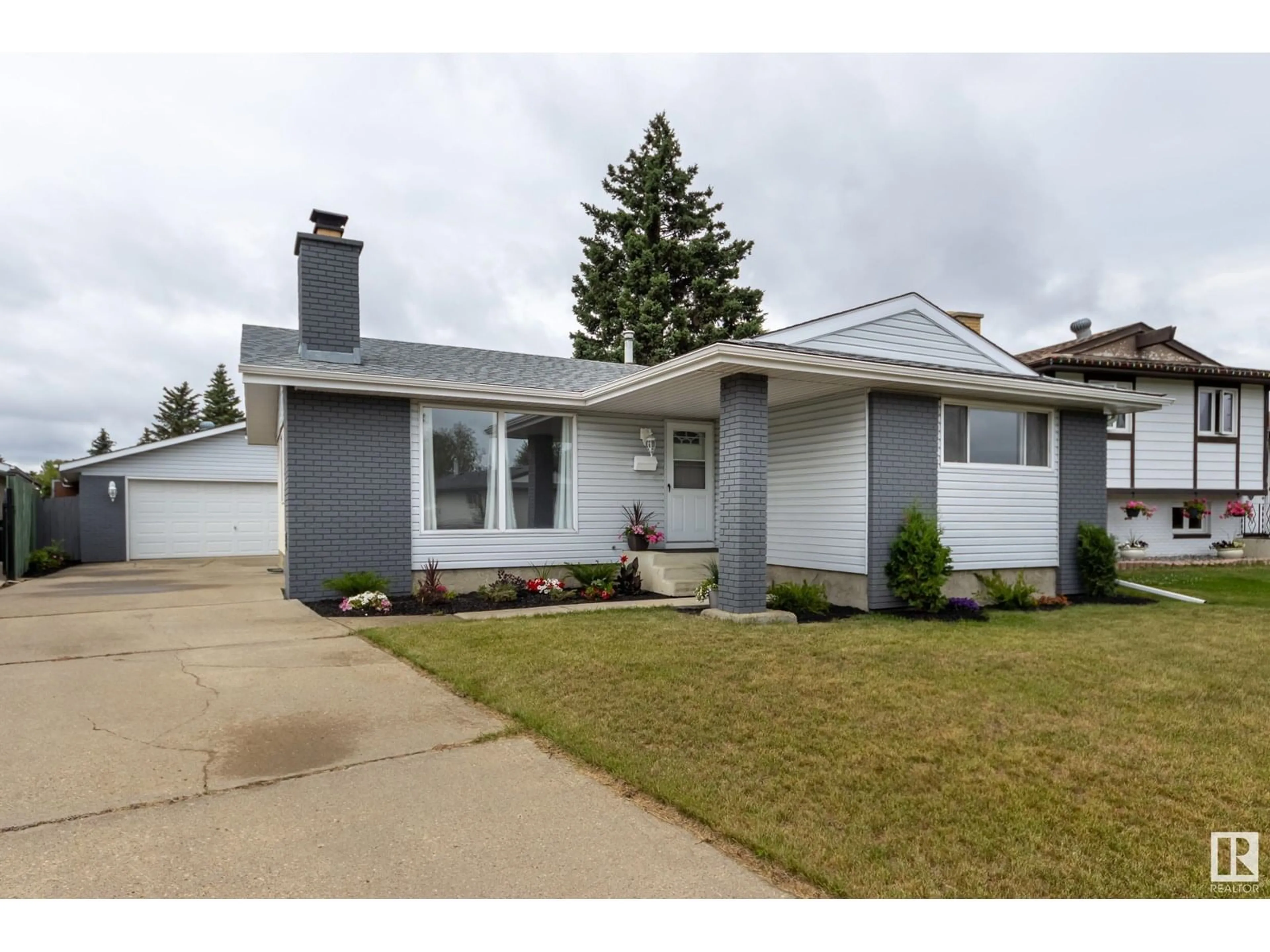 Home with vinyl exterior material, street for NW - 15228 122 ST, Edmonton Alberta T5X1P5
