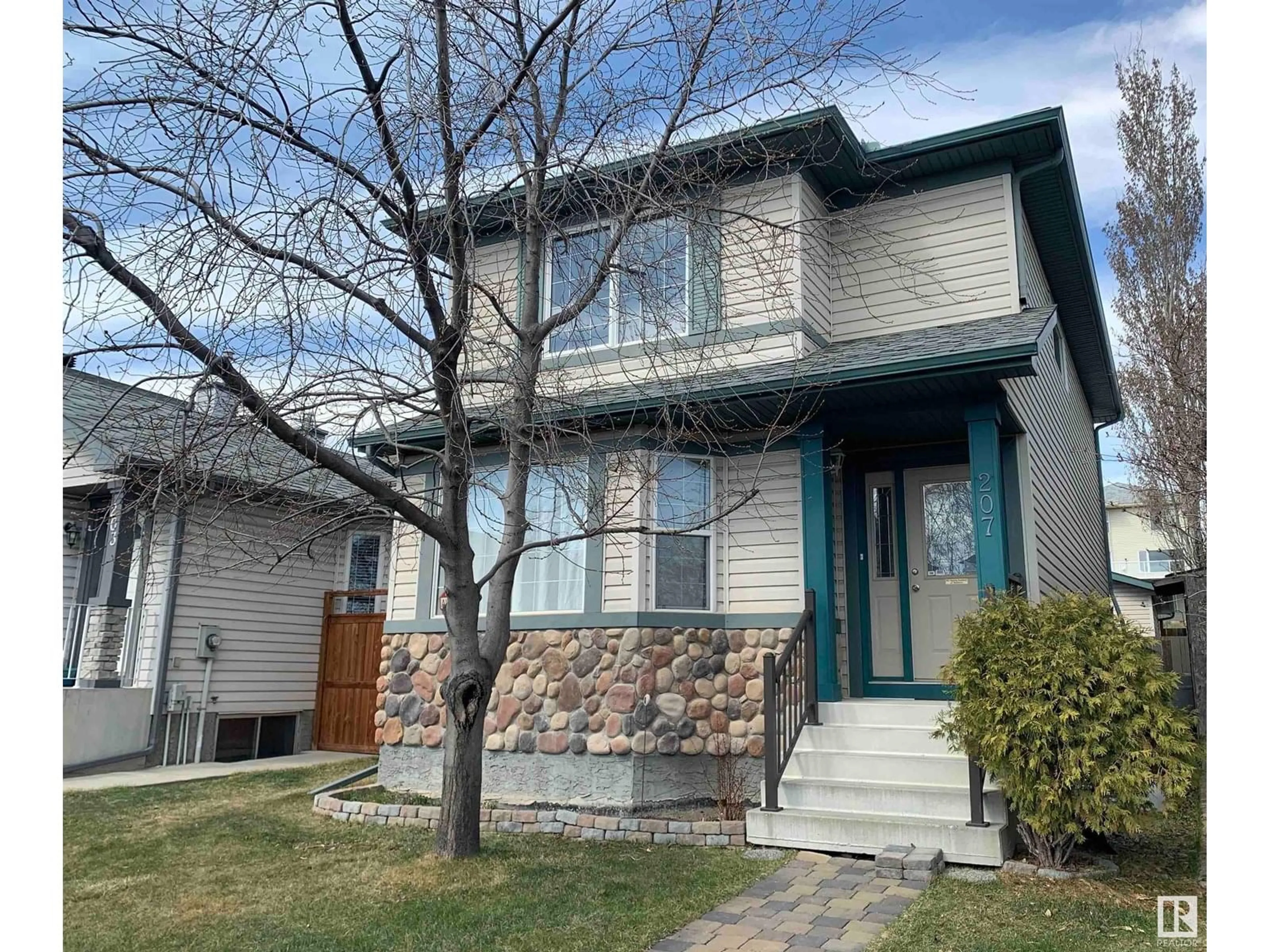 Home with vinyl exterior material, street for 207 ARBOUR MEADOWS CL, Calgary Alberta T3G5J3