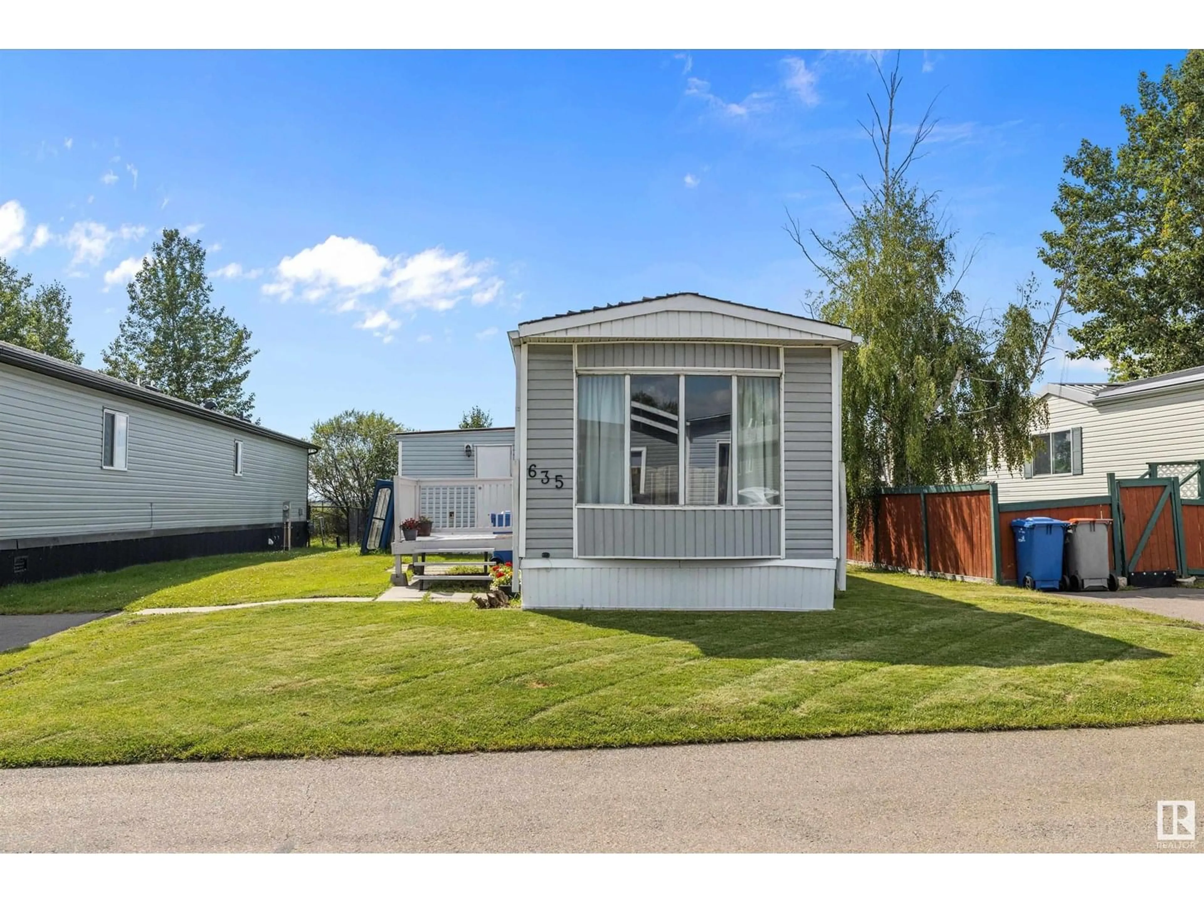 Home with vinyl exterior material, street for 635 53222 RR 272, Rural Parkland County Alberta T7X3P7
