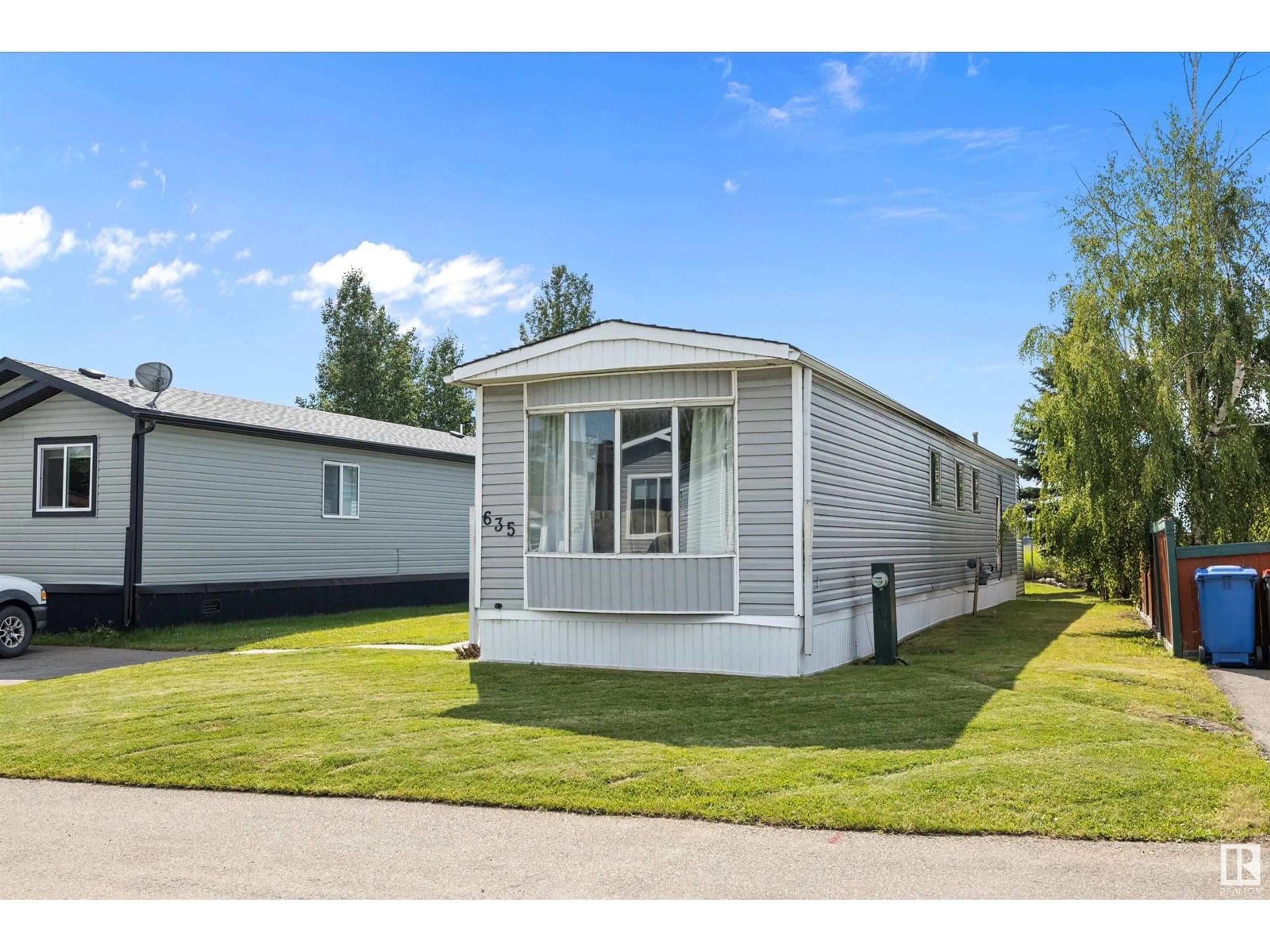 Home with vinyl exterior material, street for 635 53222 RR 272, Rural Parkland County Alberta T7X3P7