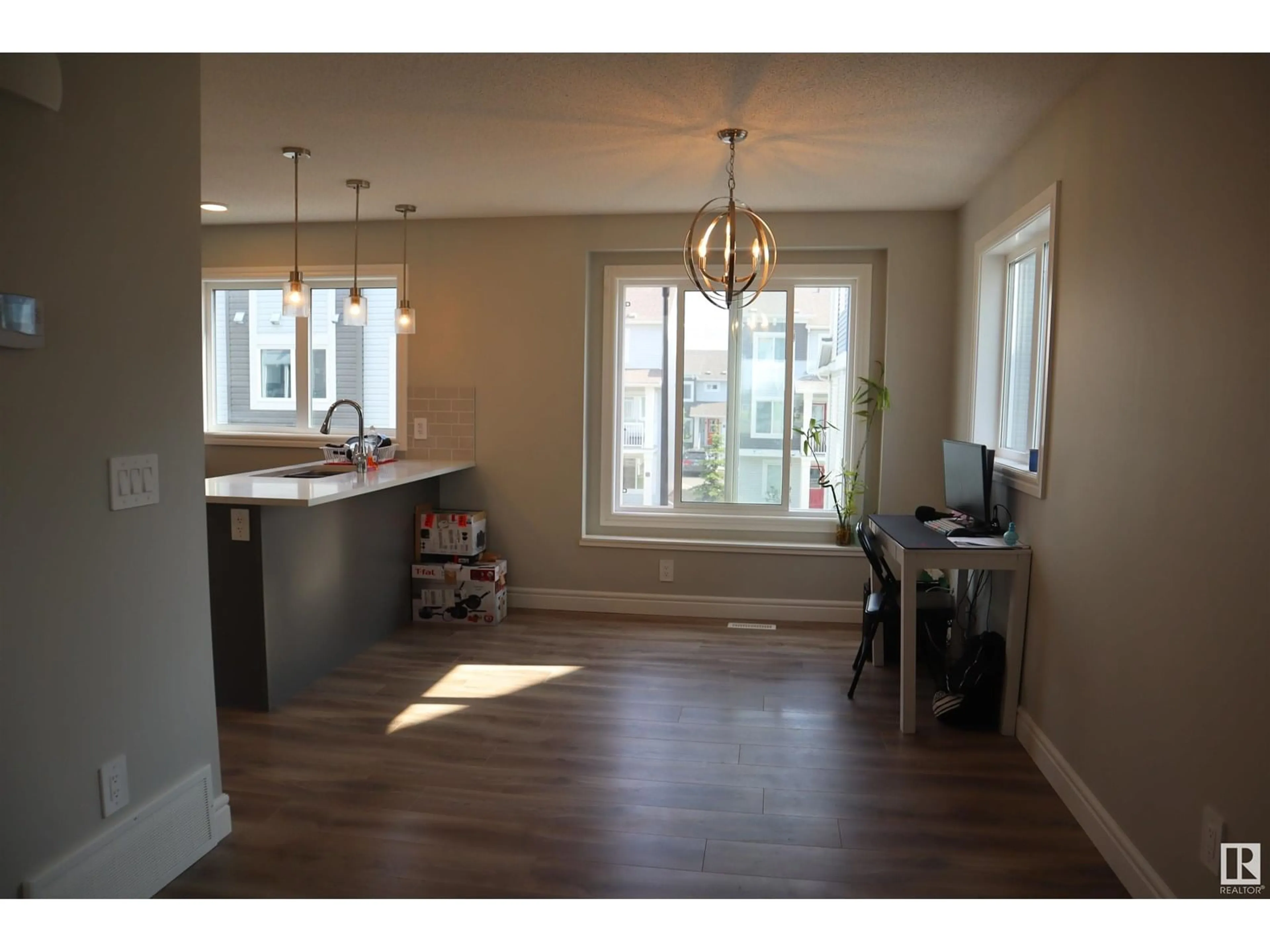 Open concept kitchen, wood/laminate floor for 76 16335 84 ST NW, Edmonton Alberta T5Z0S2