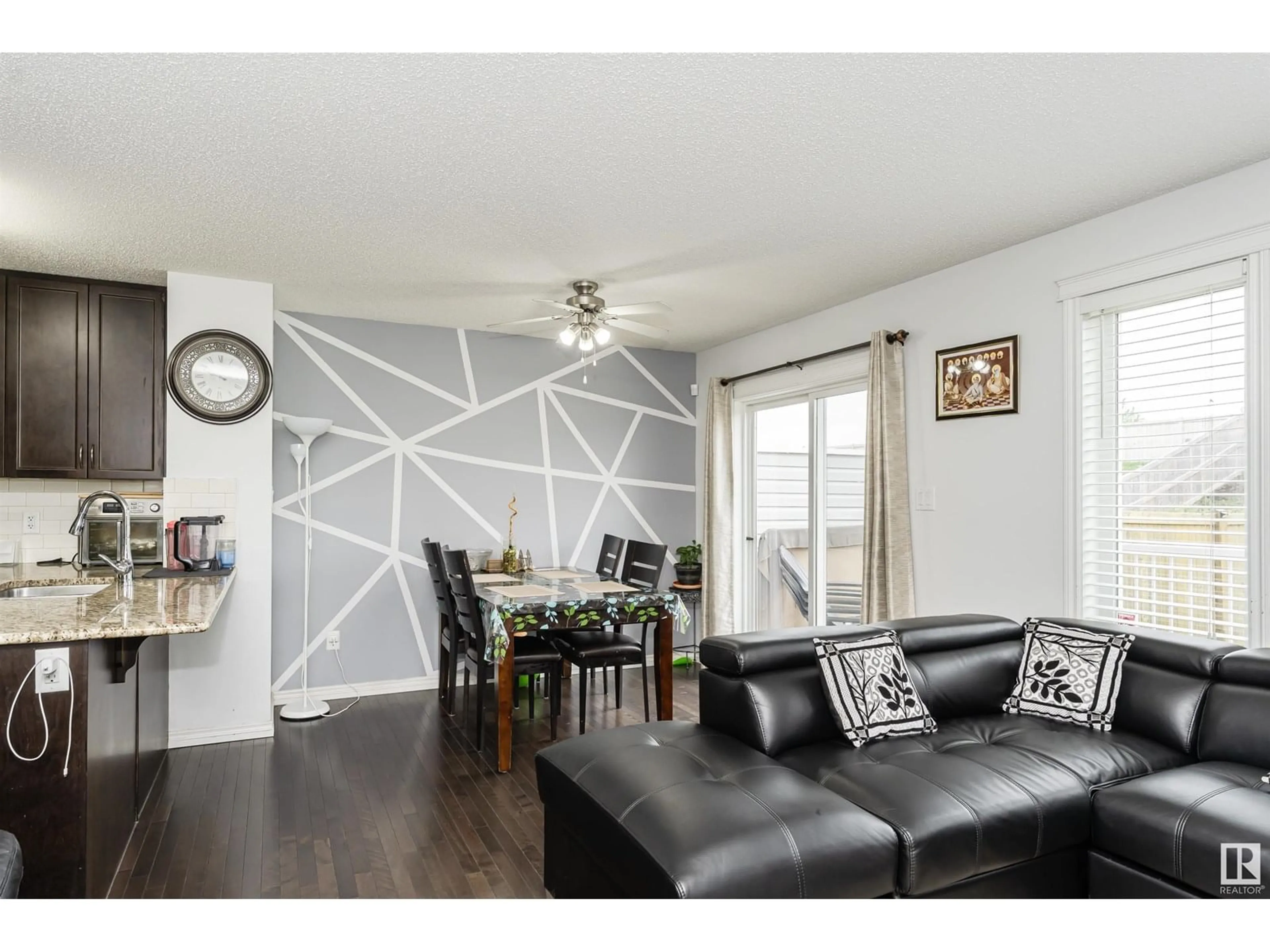 Living room with furniture, wood/laminate floor for 3722 9 ST, Edmonton Alberta T6T0S3
