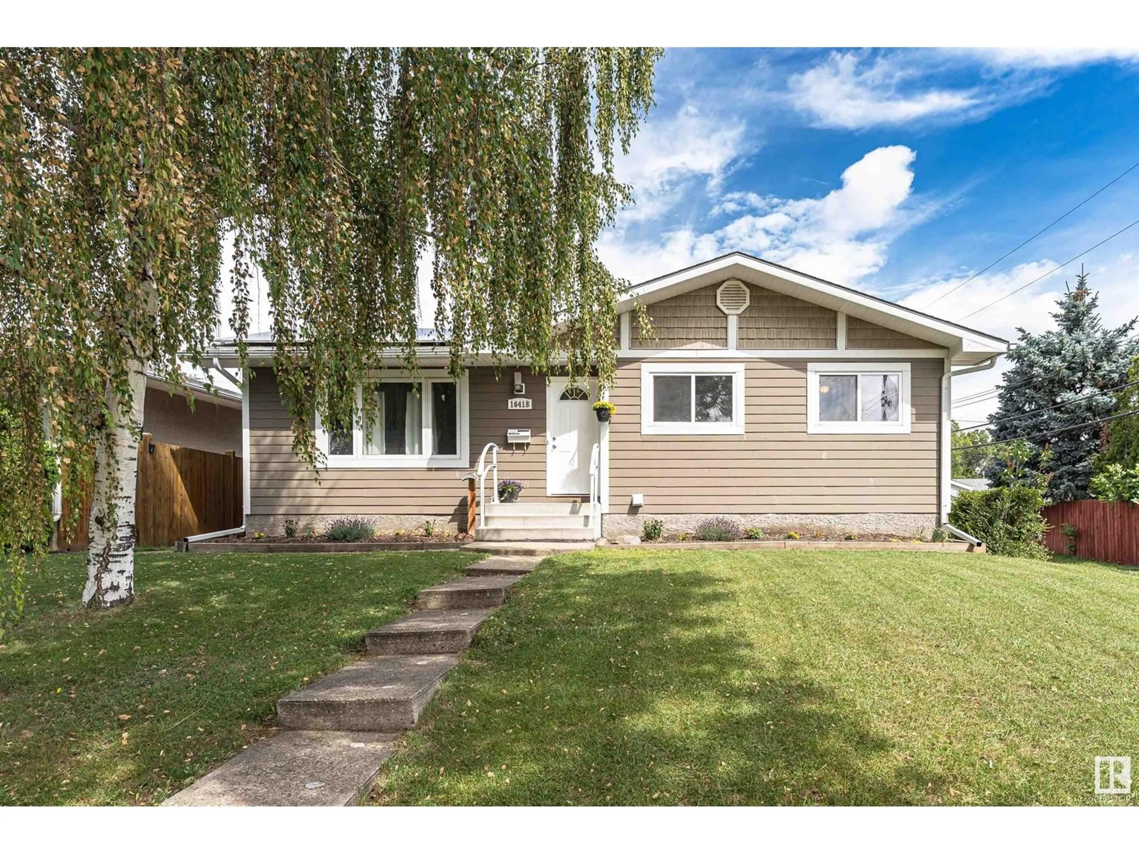Home with vinyl exterior material, street for 16418 104A AV, Edmonton Alberta T5P0T4