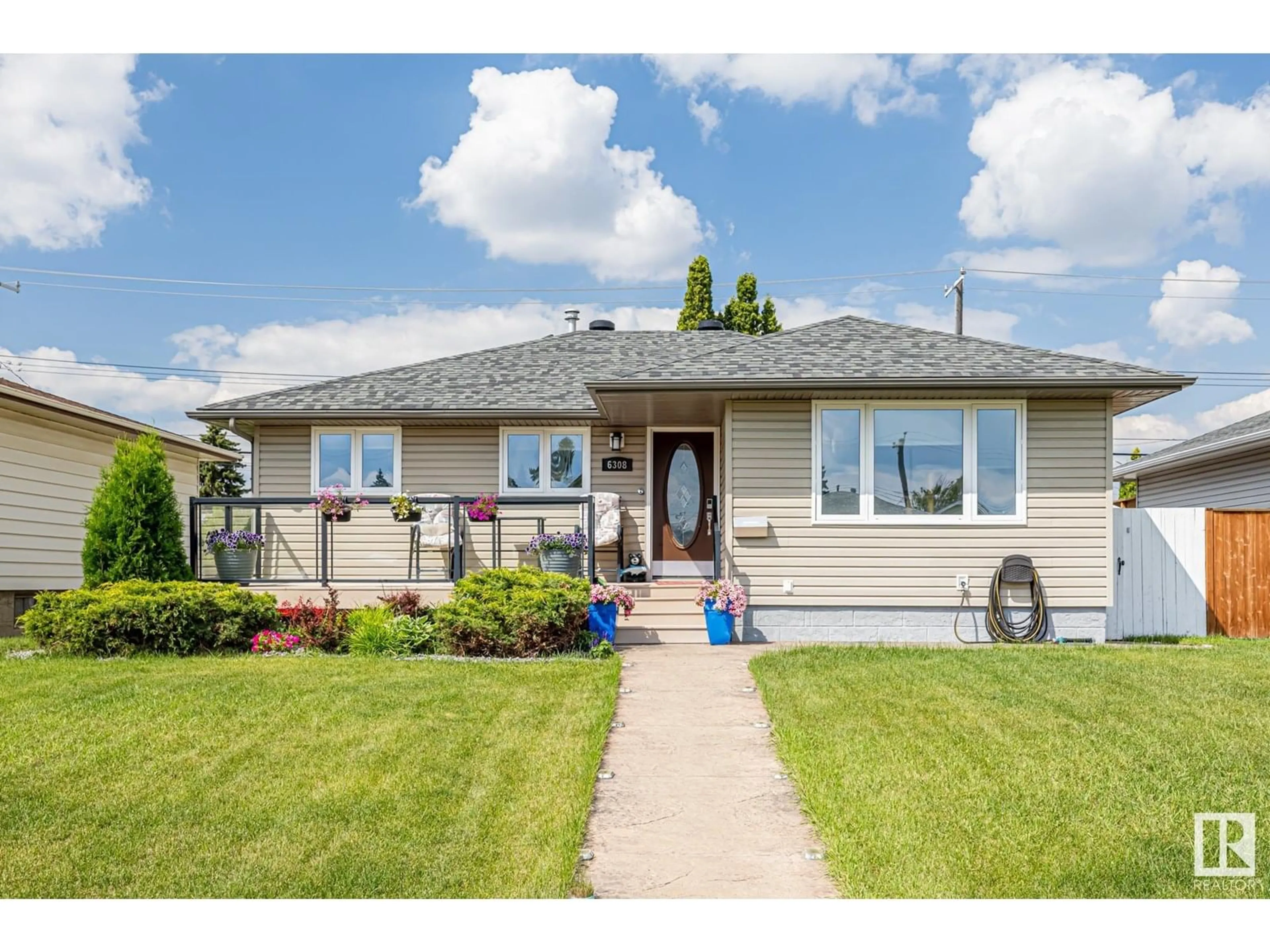 Home with vinyl exterior material, street for NW - 6308 94B AV, Edmonton Alberta T6B0Z6