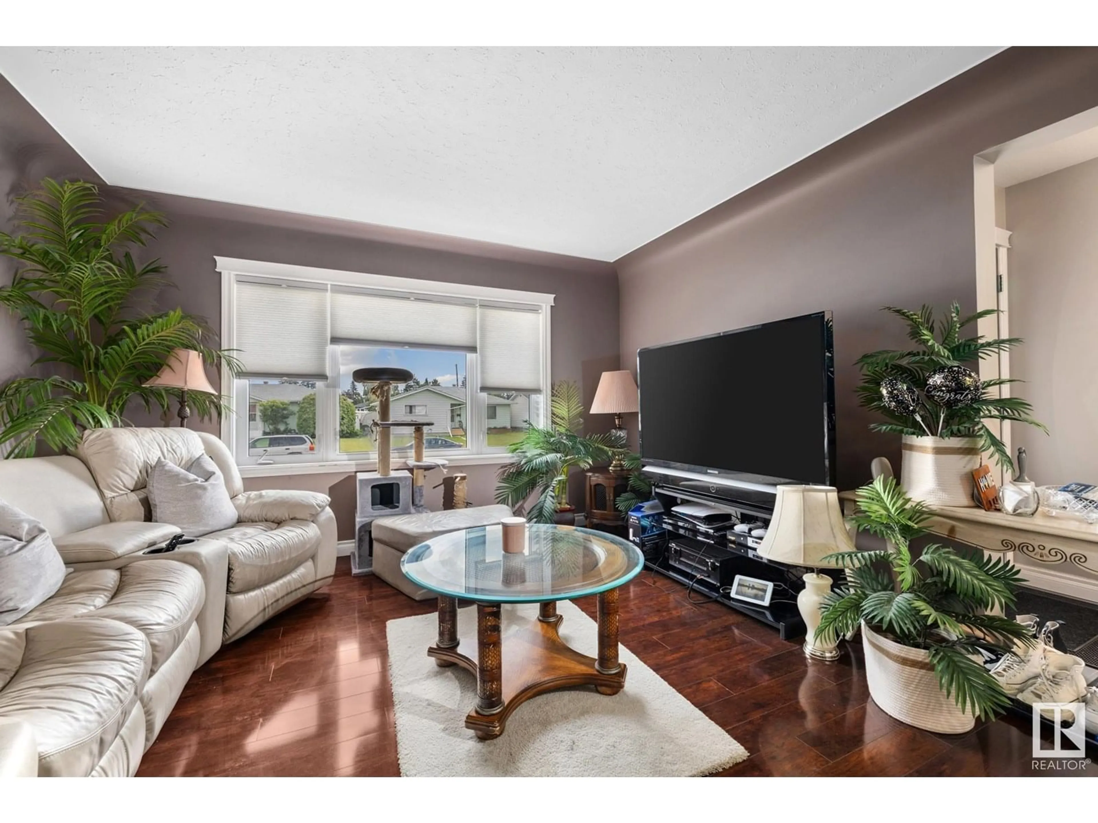 Living room with furniture, wood/laminate floor for NW - 6308 94B AV, Edmonton Alberta T6B0Z6