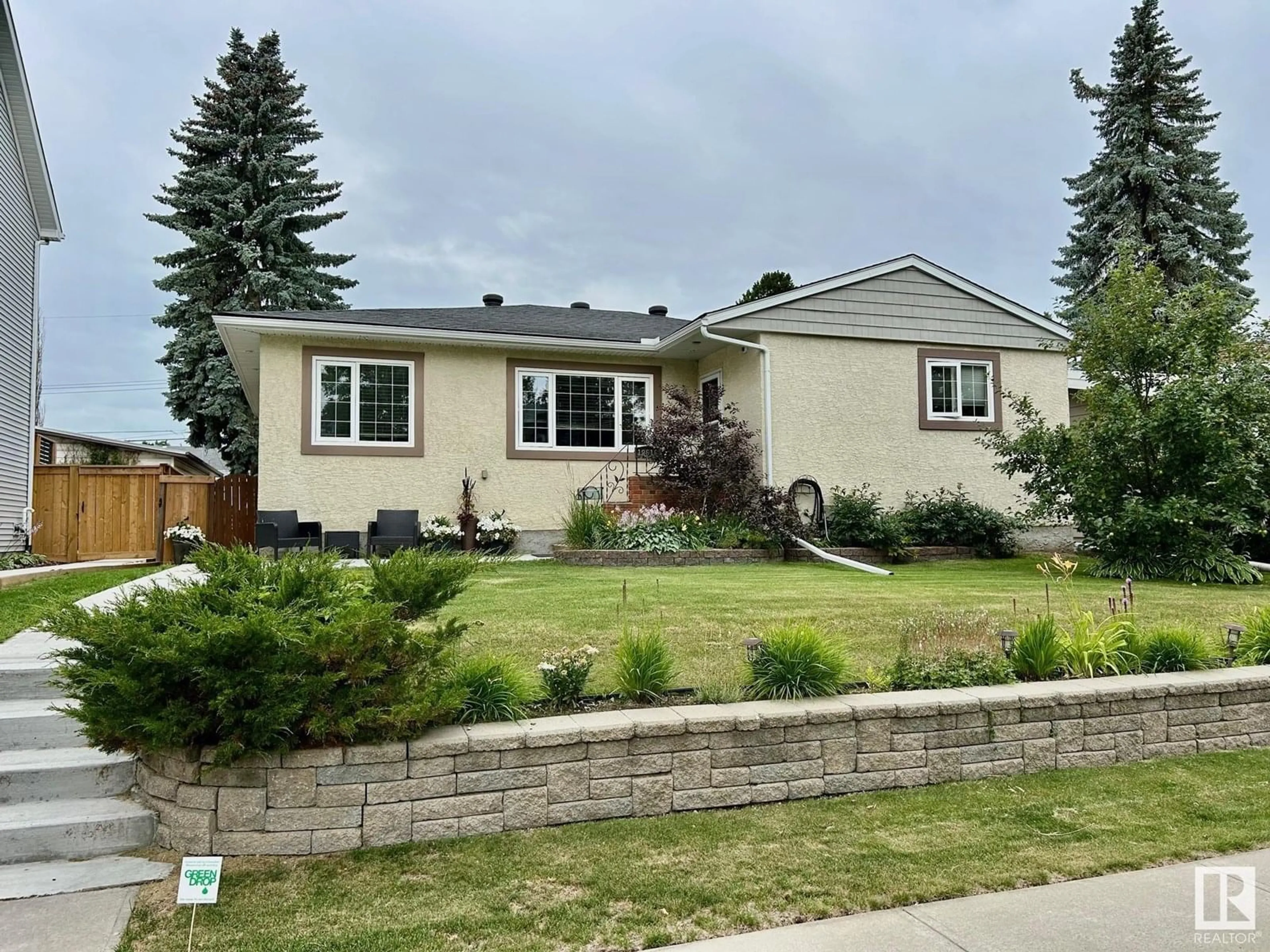 Home with vinyl exterior material, street for NW - 10616 136 ST, Edmonton Alberta T5N2G2