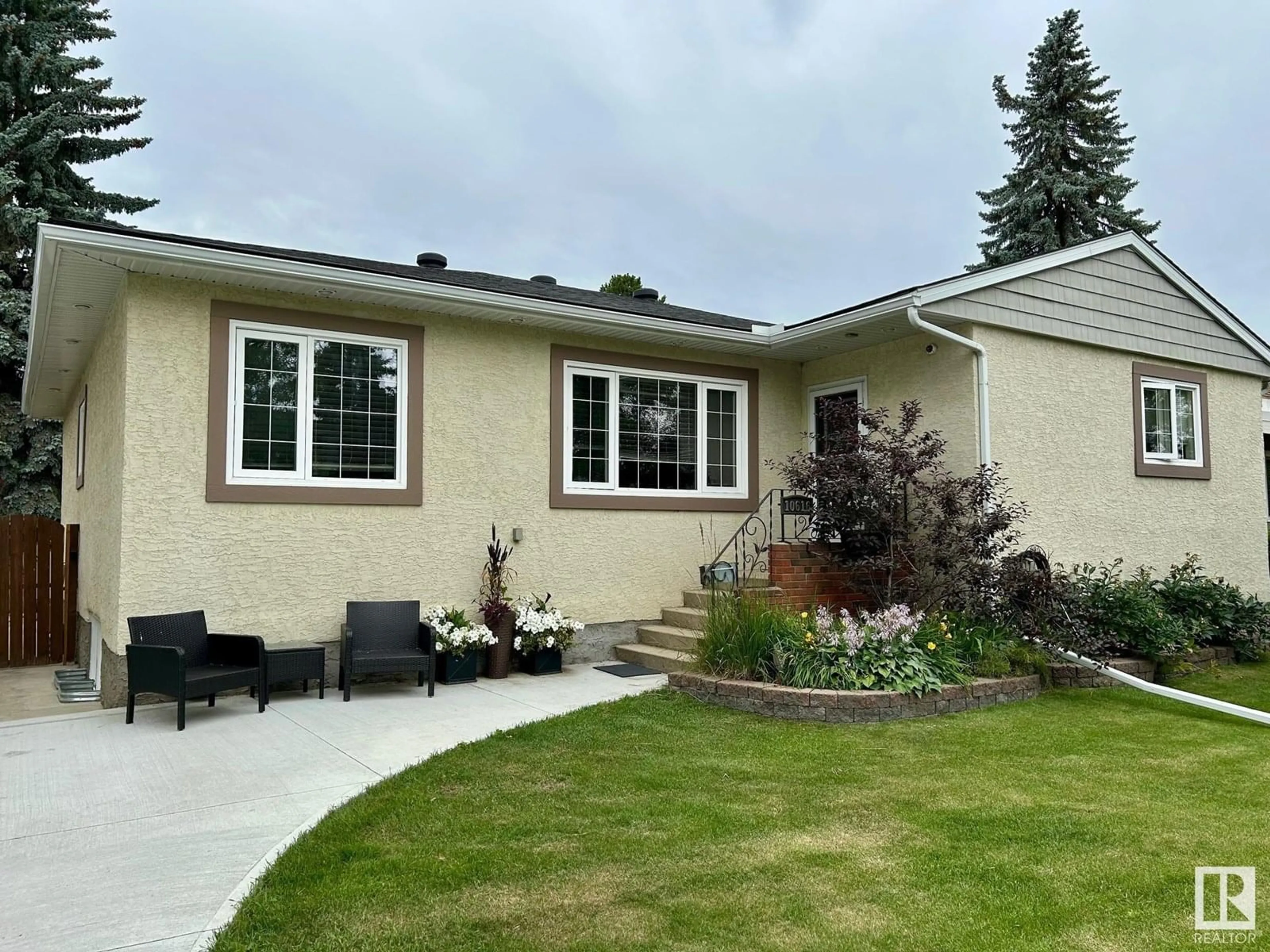 Home with vinyl exterior material, street for NW - 10616 136 ST, Edmonton Alberta T5N2G2
