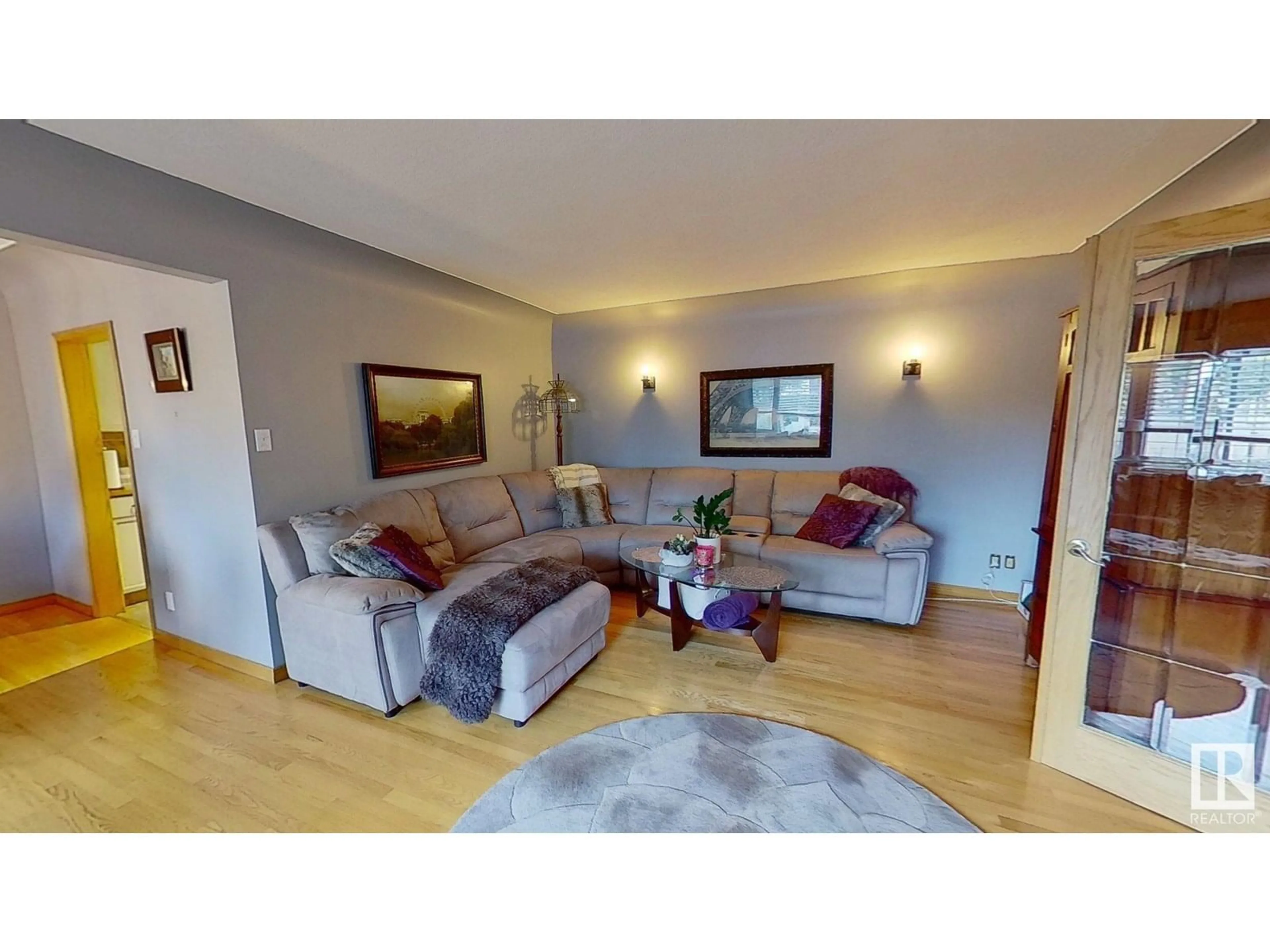 Living room with furniture, wood/laminate floor for NW - 10616 136 ST, Edmonton Alberta T5N2G2