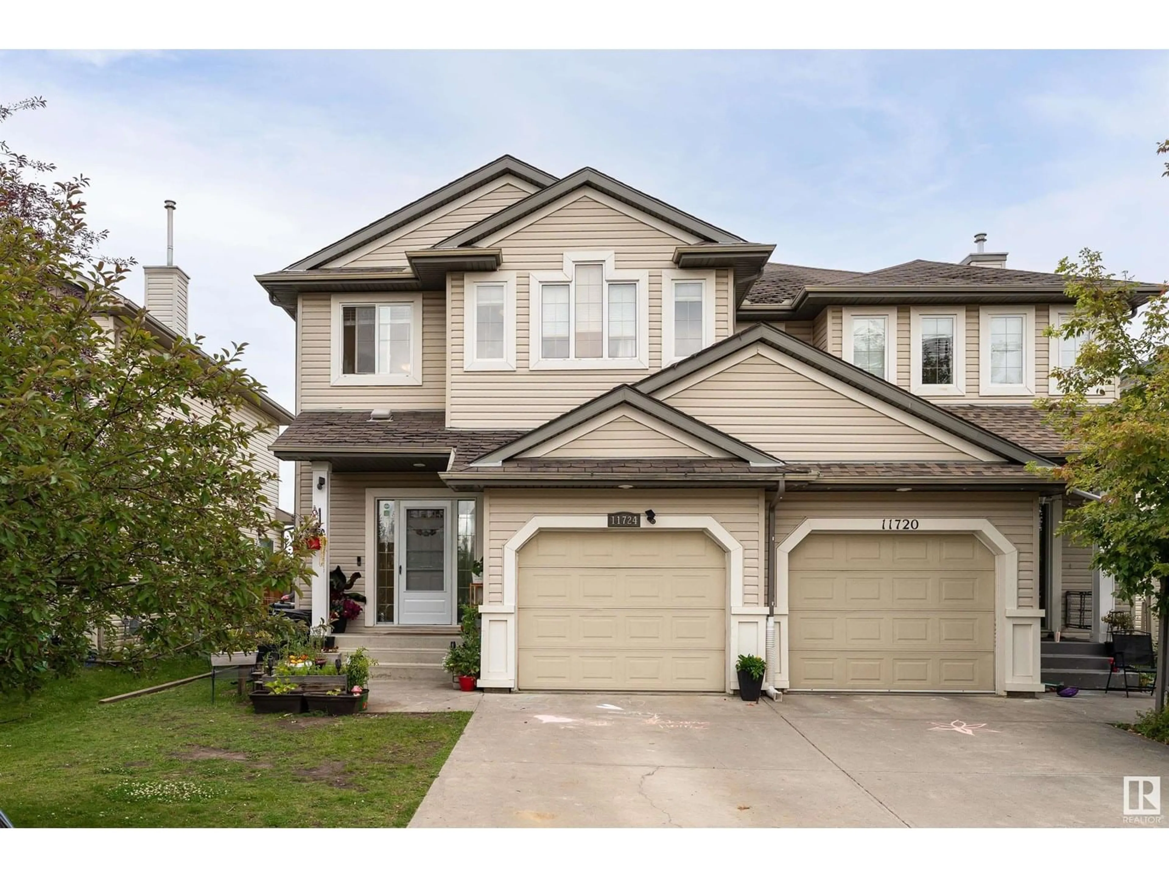 Home with vinyl exterior material, street for SW - 11724 10 AV, Edmonton Alberta T6W0B7