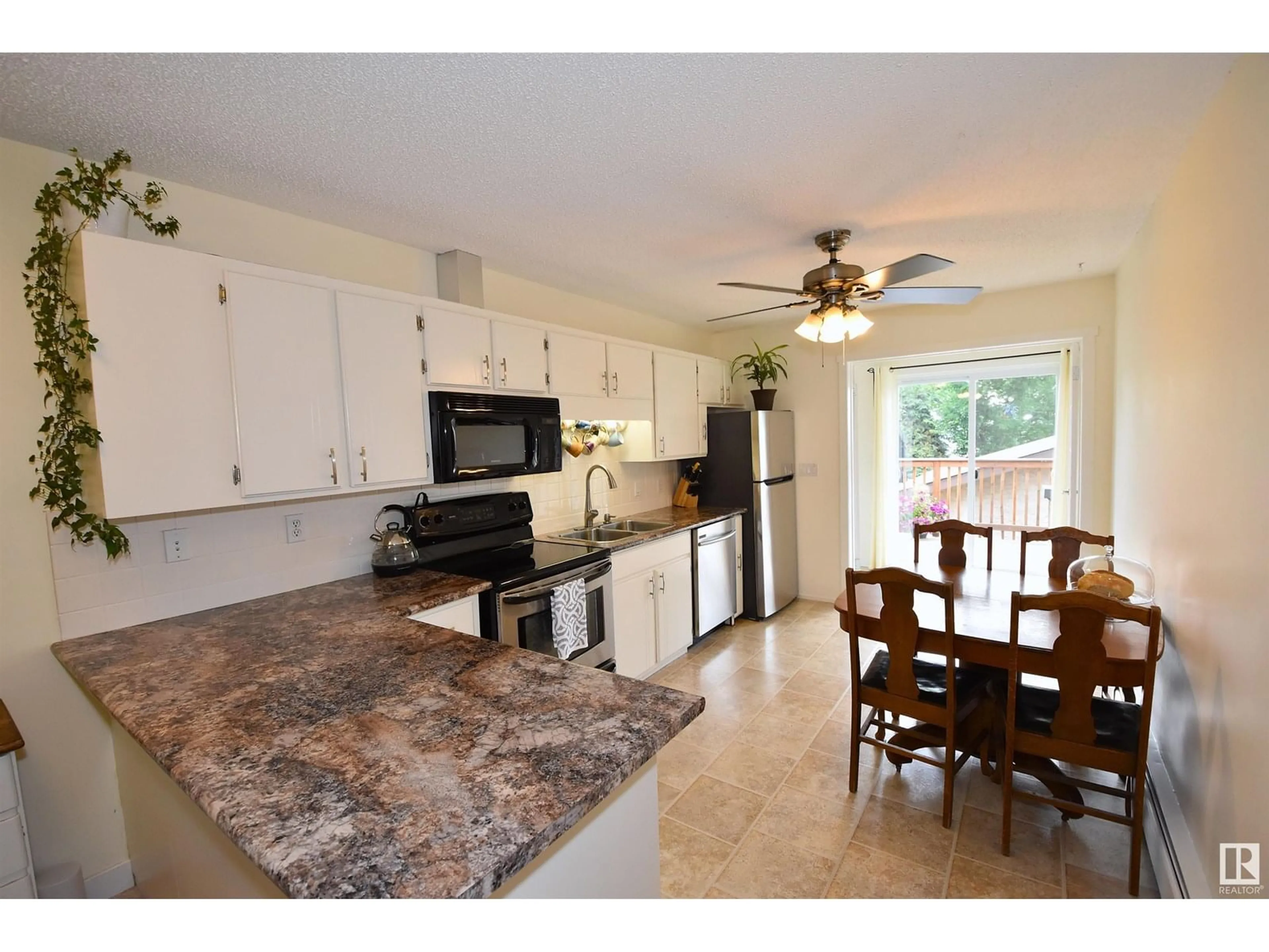 Open concept kitchen, ceramic/tile floor for 5108 57 AV, Stony Plain Alberta T7Z1A5